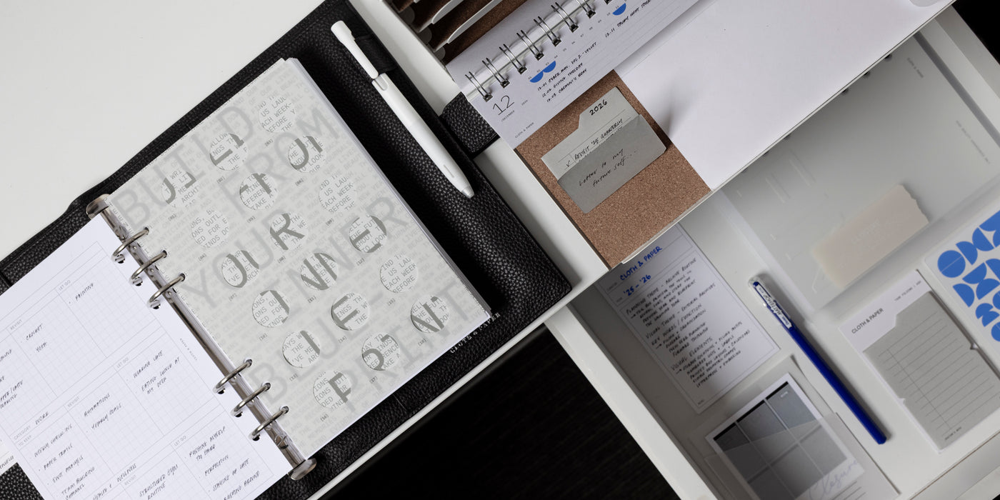 a notebook and pen on a table