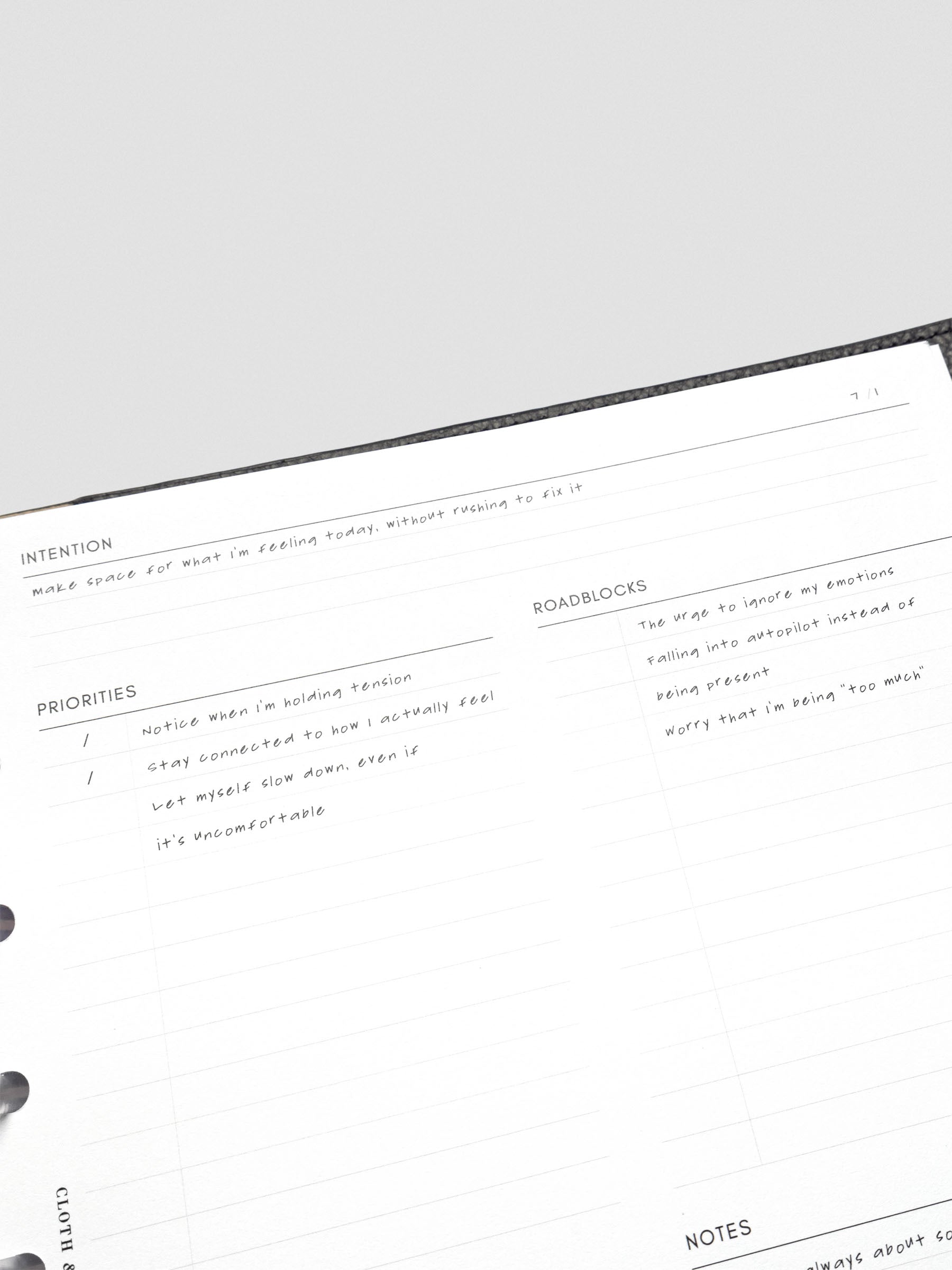 Close up of the Daily intention Planner Inserts showing the header and sections for Intention, Priorities, and Roadblocks with example text filled in on the theme of making space for what I'm feeling today without trying to fix it.