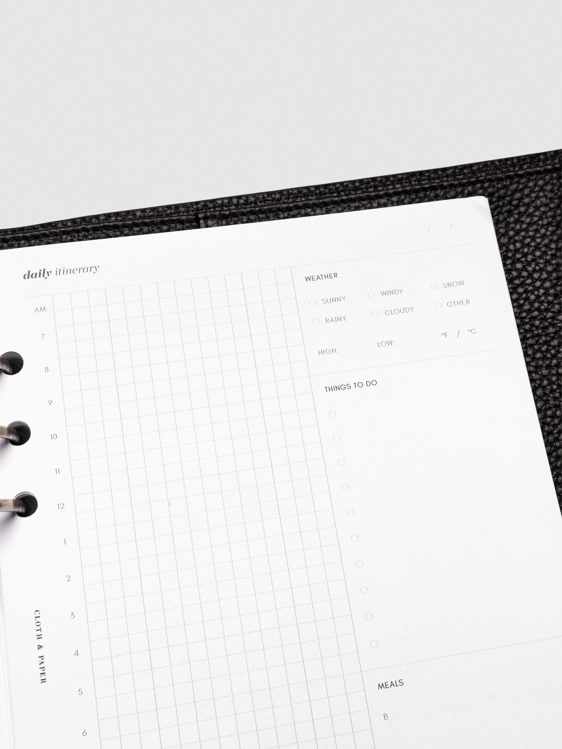 Insert in use inside a black leather folio.