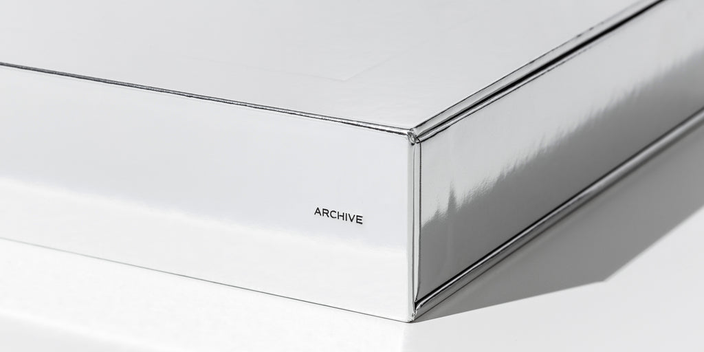 An image representing a spoiler of our new Archive Box in silver.  One corner of the box has the word Archive on it.