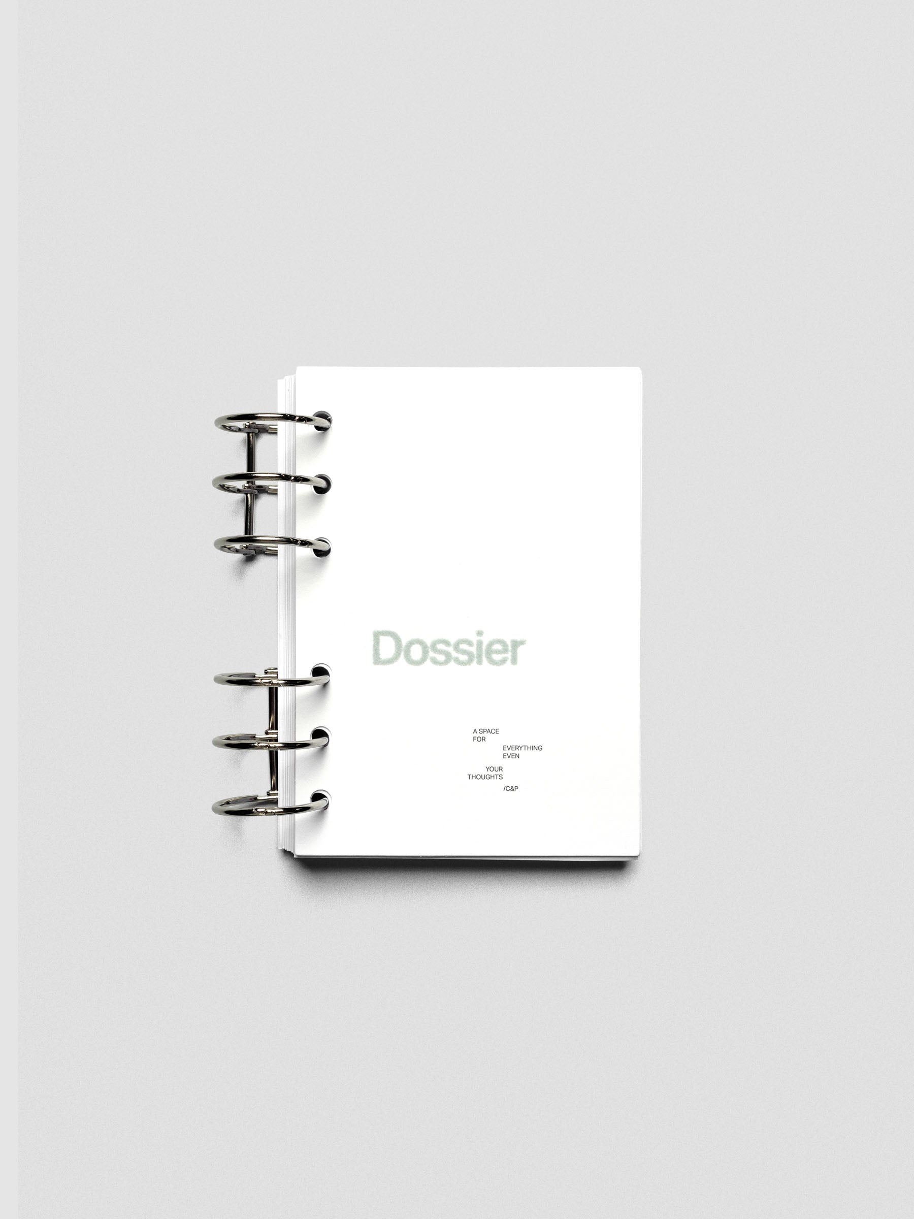 Dossier Planner Dashboard in A6 size shown ring bound.