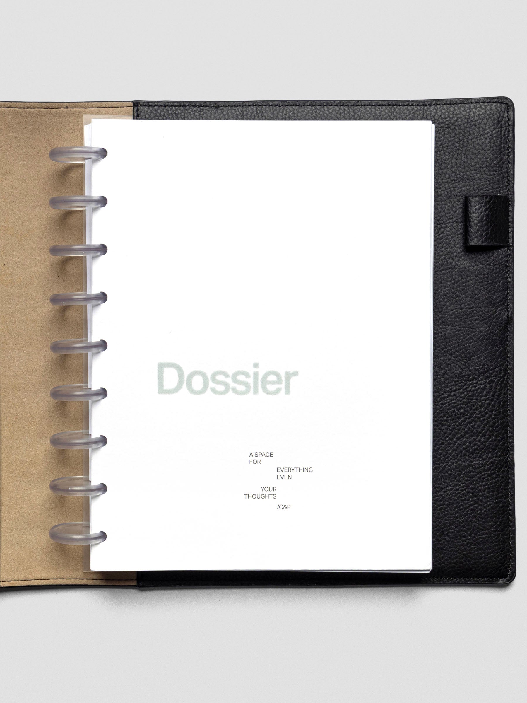 Dossier Planner Dashboard in HP Classic size shown disc bound in a leather planner cover.