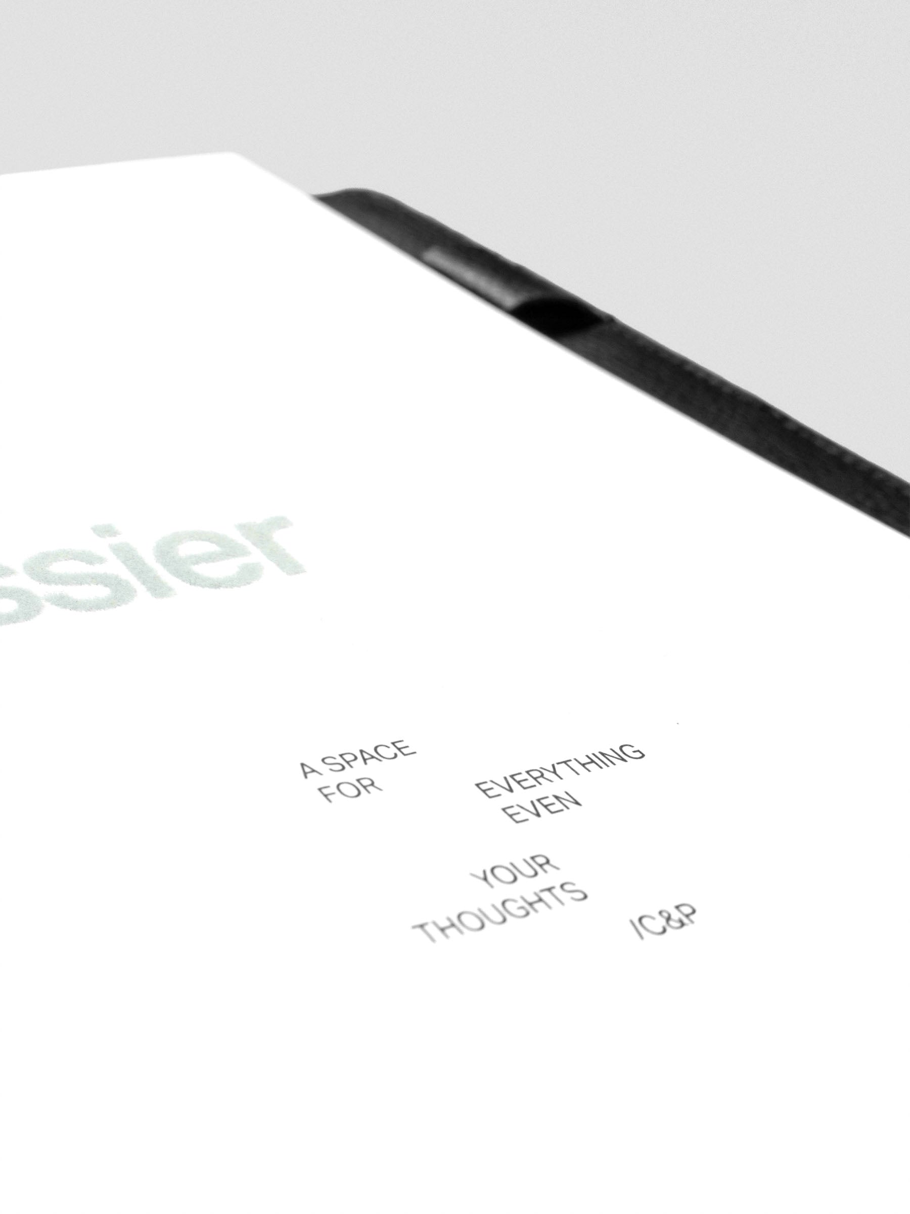 Close up of black printed text design on Dossier Planner Dashboard reading "A space for everything even your thoughts / C&P".