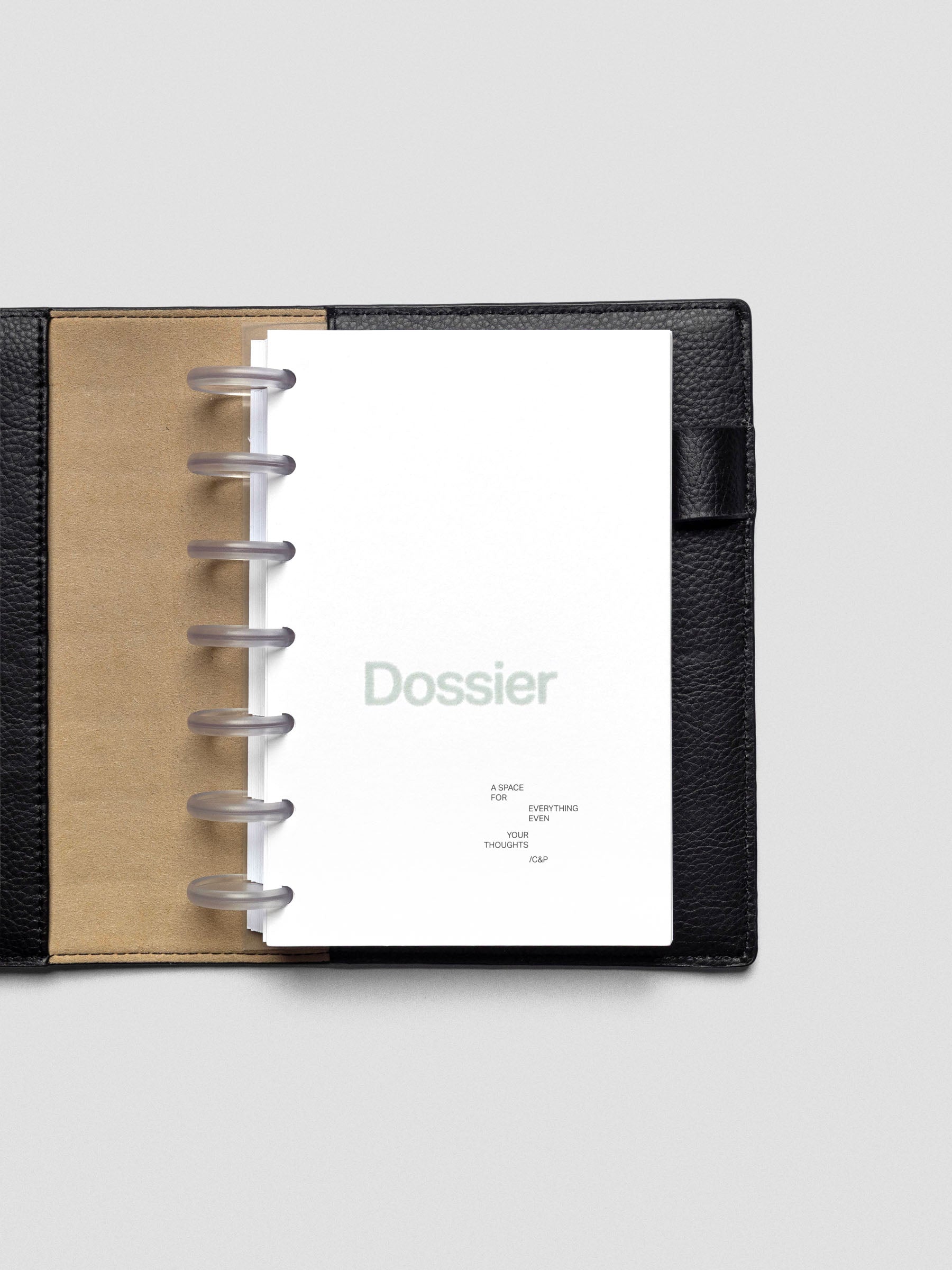 Dossier Planner Dashboard in HP Mini size shown disc bound in a leather planner cover.
