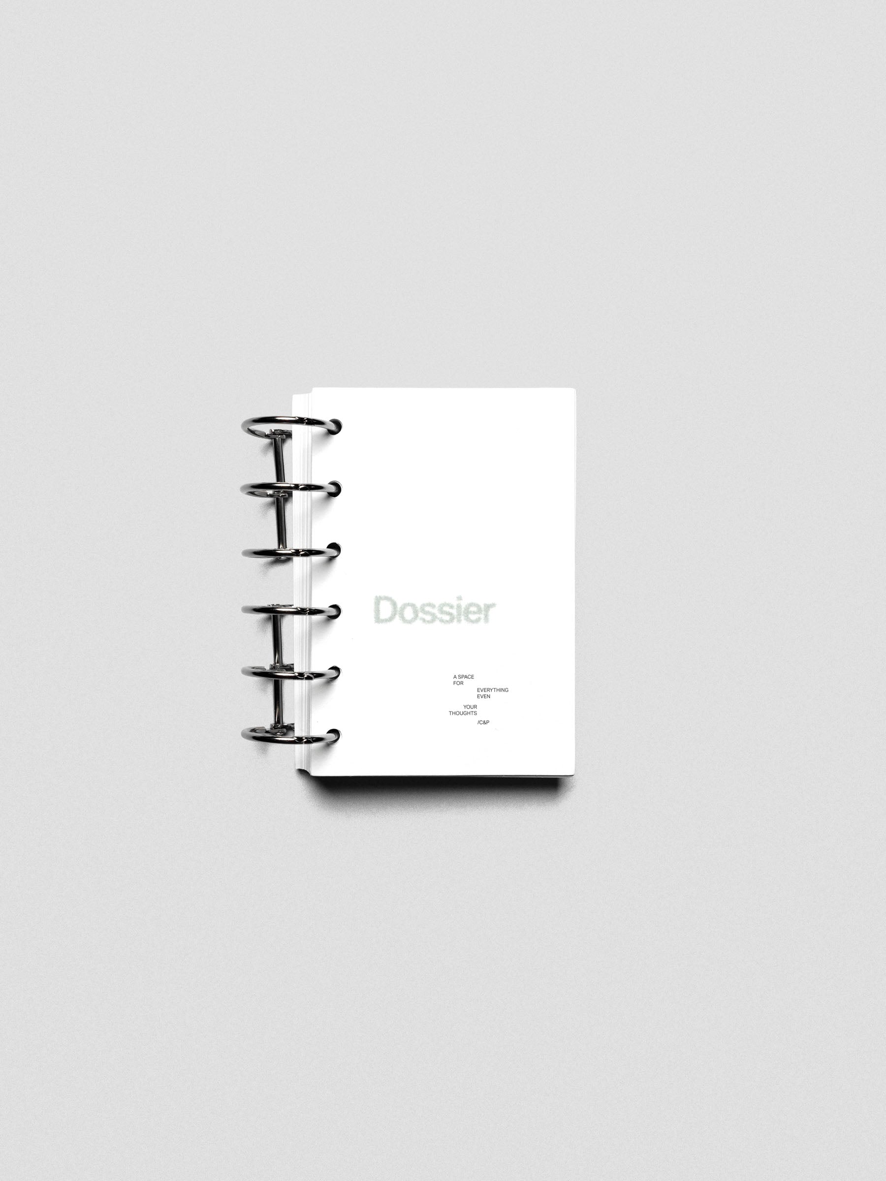 Dossier Planner Dashboard in Pocket size shown ring bound.
