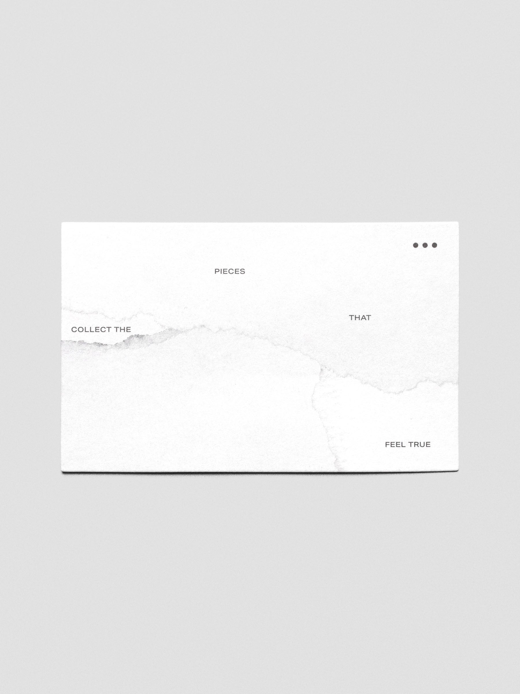 White journaling card with a marble printed design that reads "Collect the pieces that feel true".
