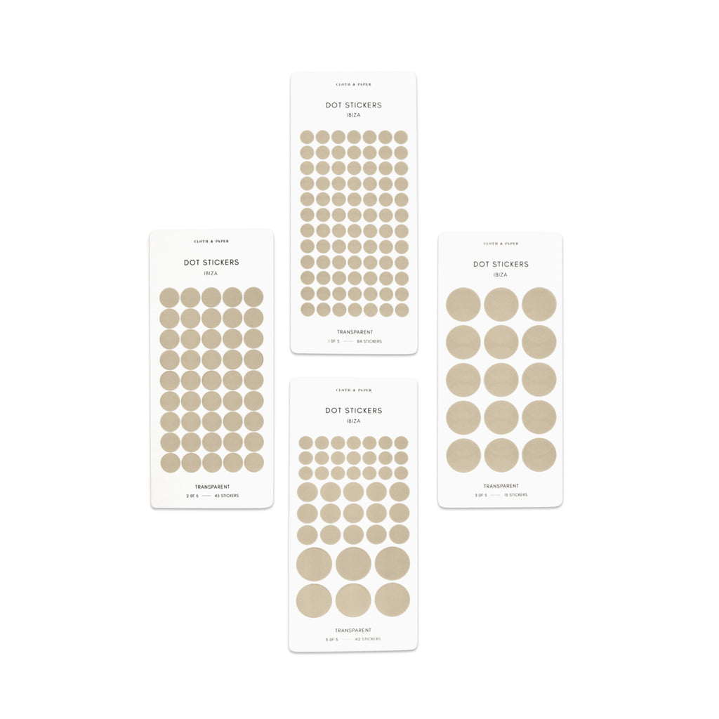 Four sheets of Ibiza dot stickers with varying sizes placed parallel to each other on a white background.