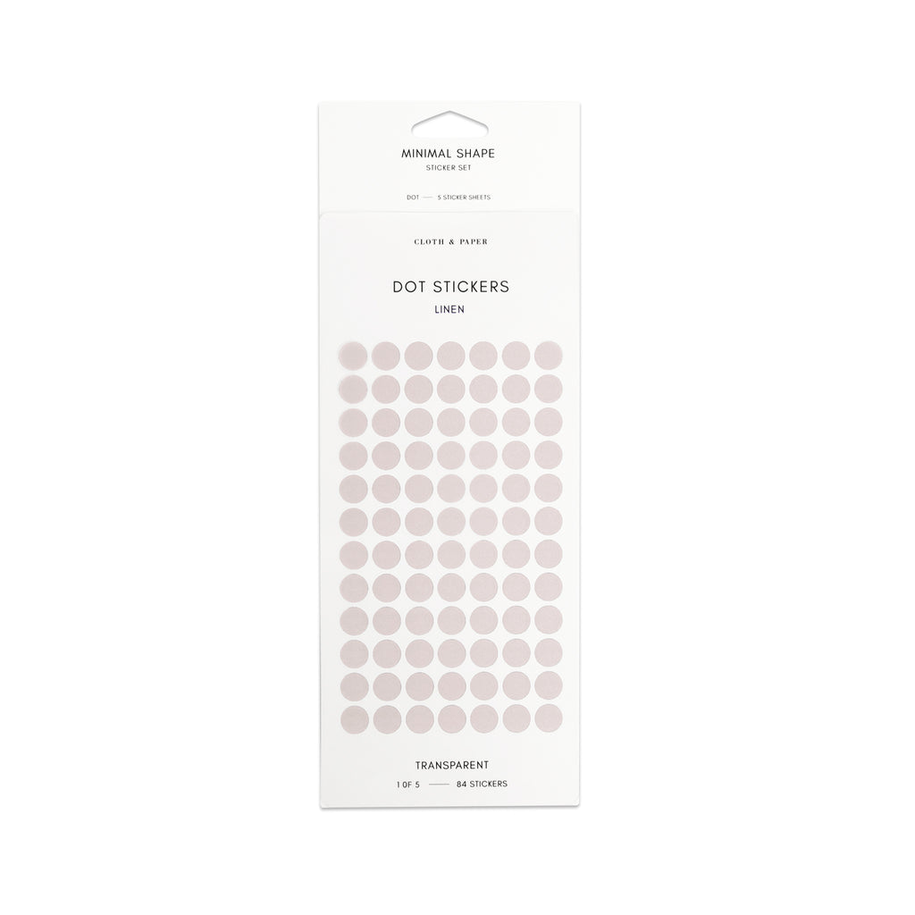 Linen-colored dot stickers in their packaging on a white background.