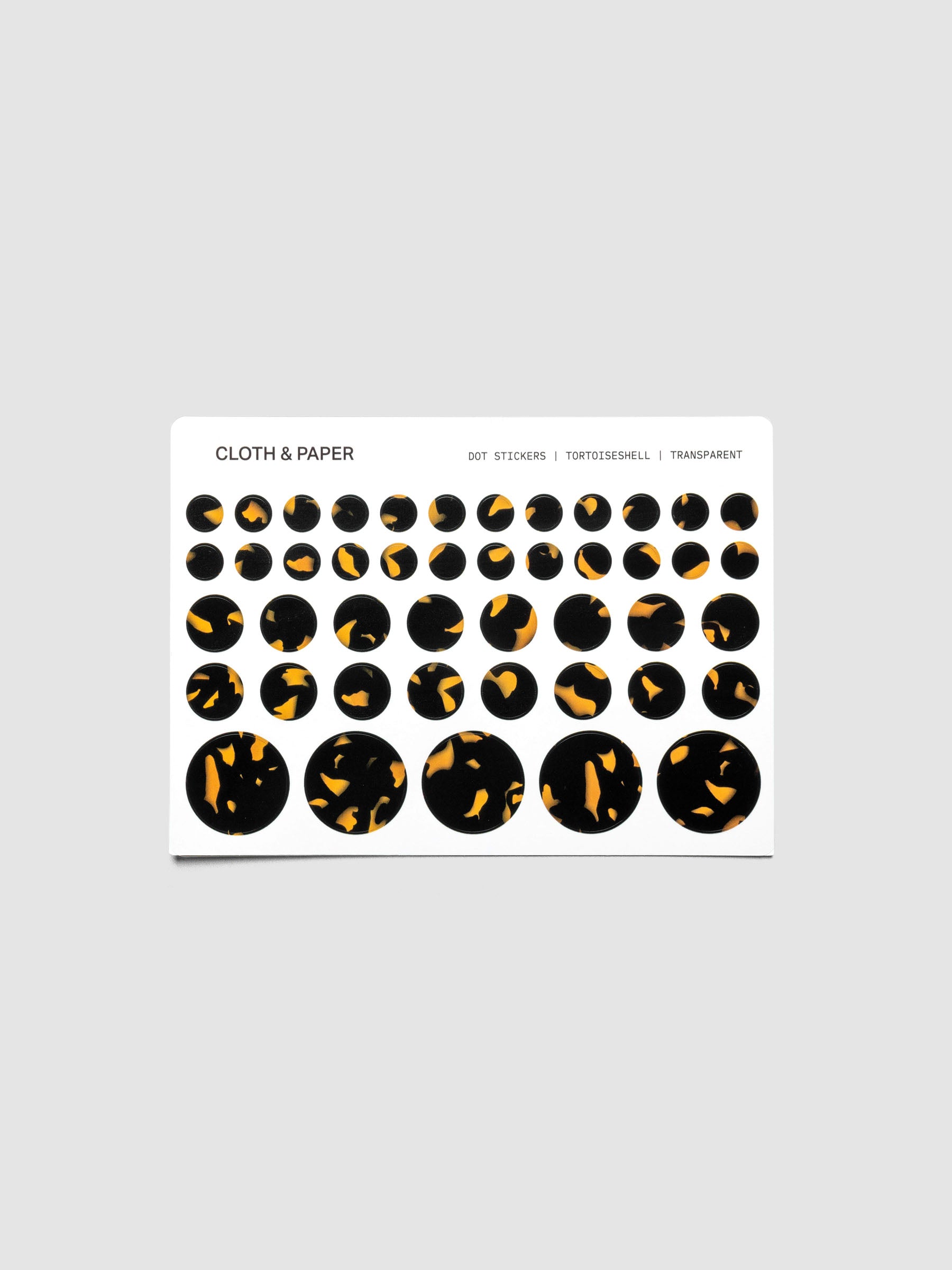 Dot Stickers, Tortoiseshell, Cloth and Paper with small, medium, and large circle stickers shown on one sheet. Stickers displayed on a neutral background.