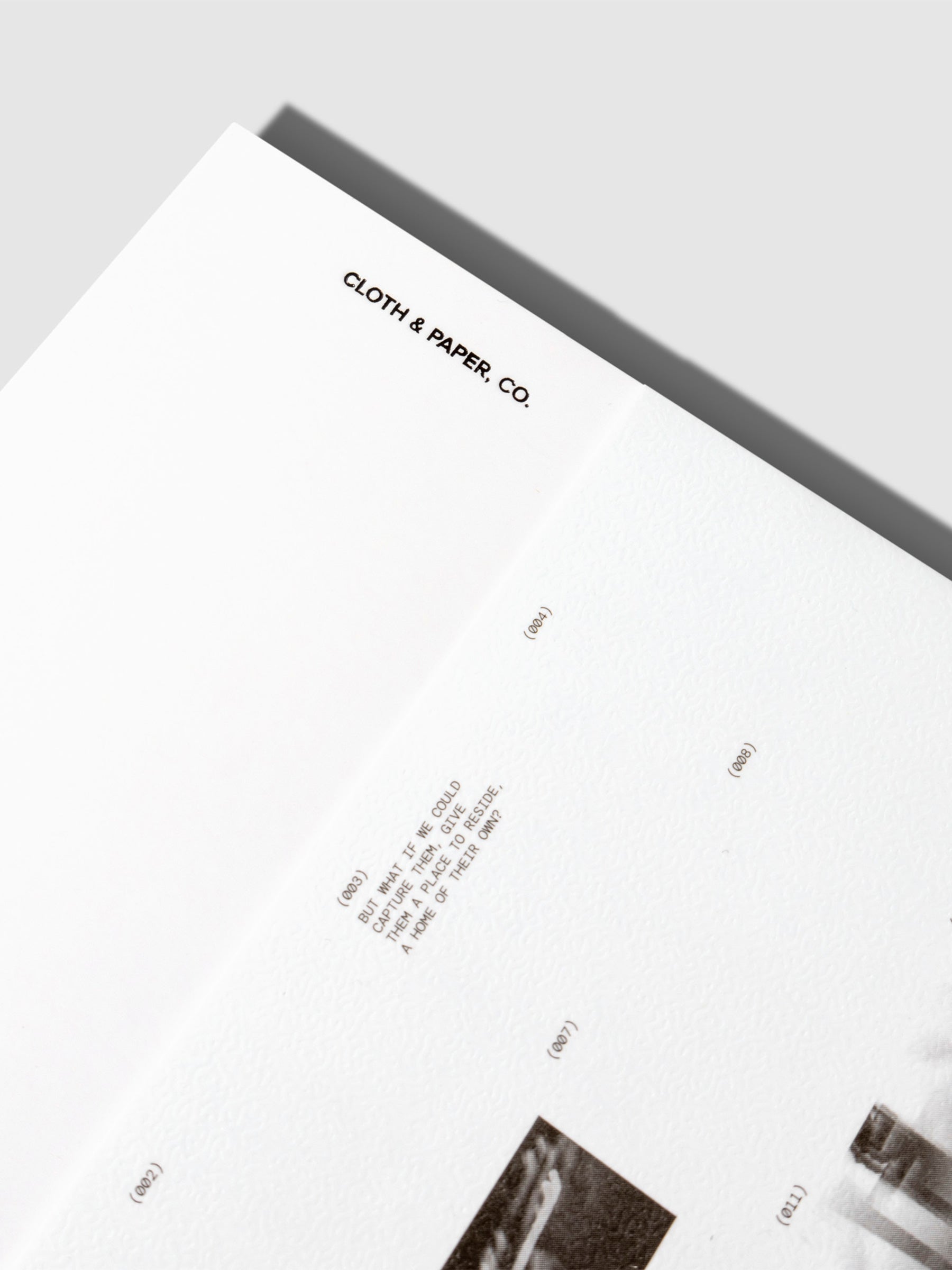 Closeup of notebook displayed on a neutral background.