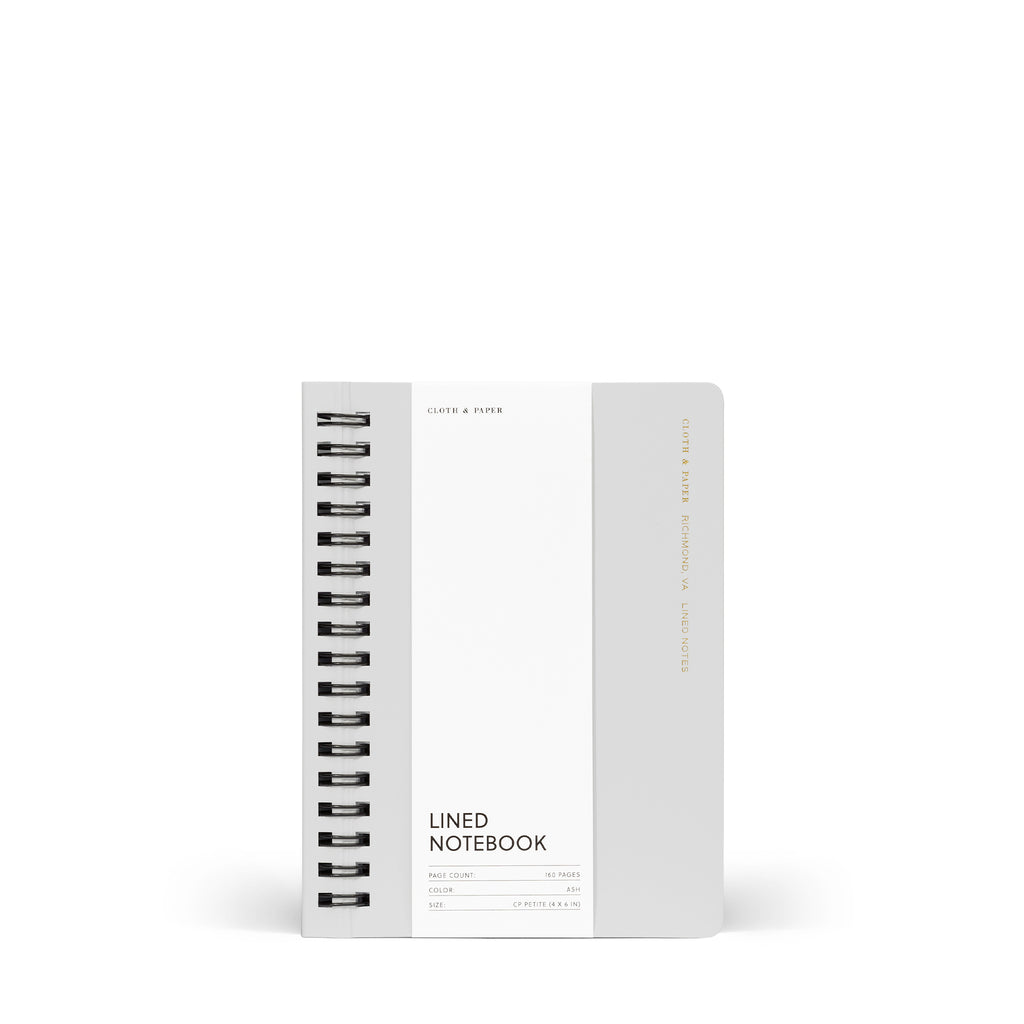 Notebook with packaging displayed on a white background. Color pictured is Ash.
