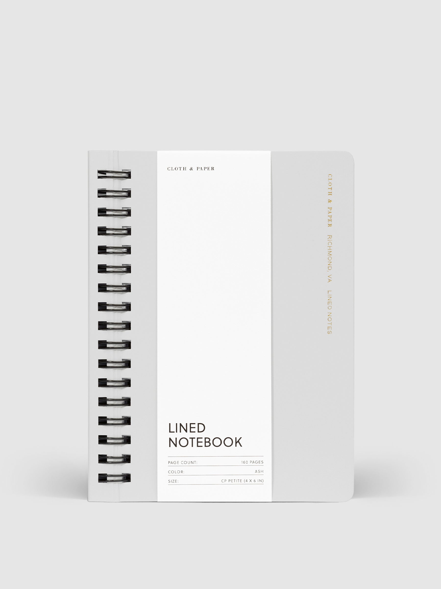 Notebook with packaging displayed on a neutral background. Color pictured is Ash.
