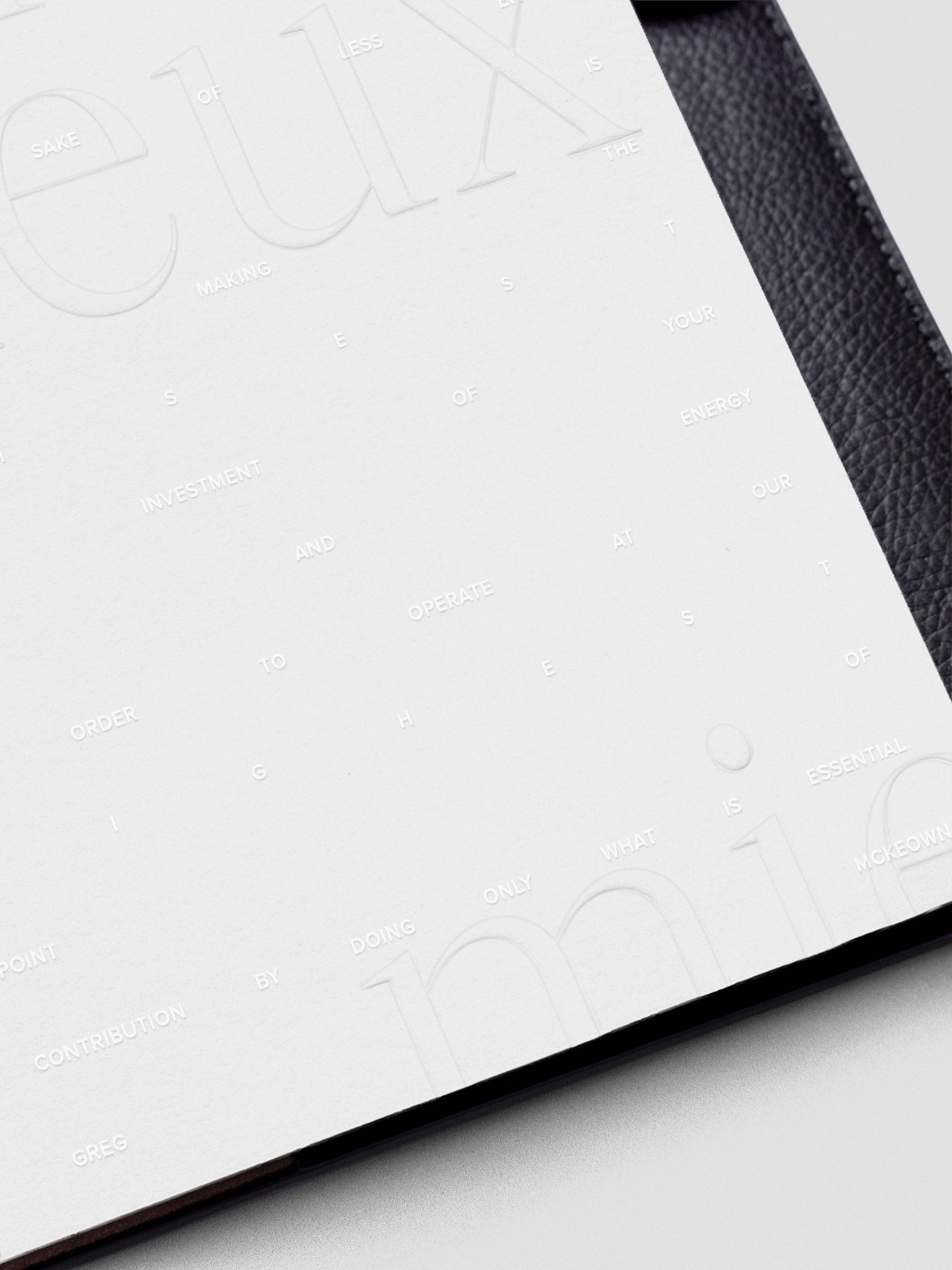 Essentialism Dashboard Duo reading "moins mai mieux" in size Half Letter; close up.