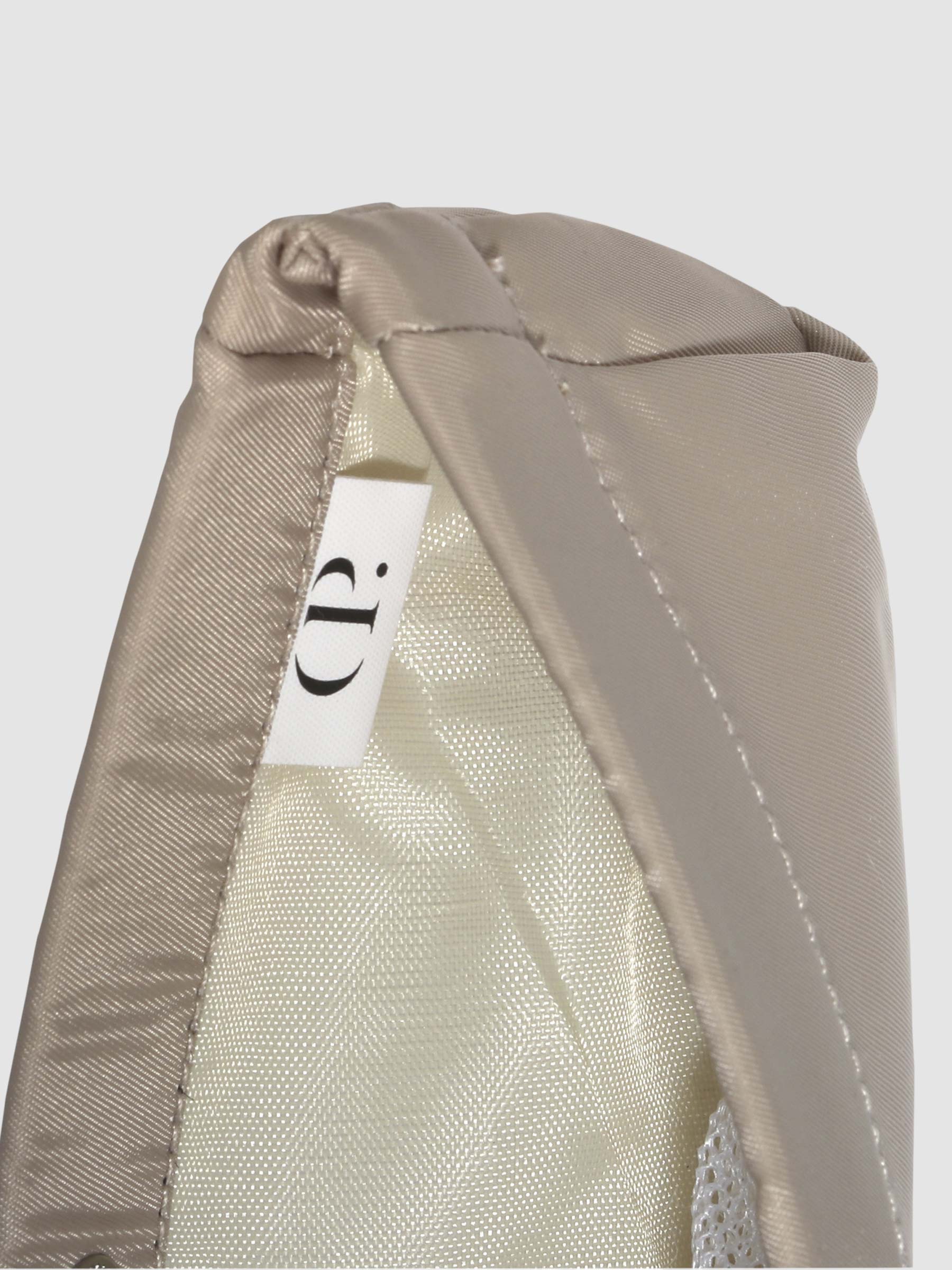 Closeup of Cloth and Paper logo inside Cream liner.