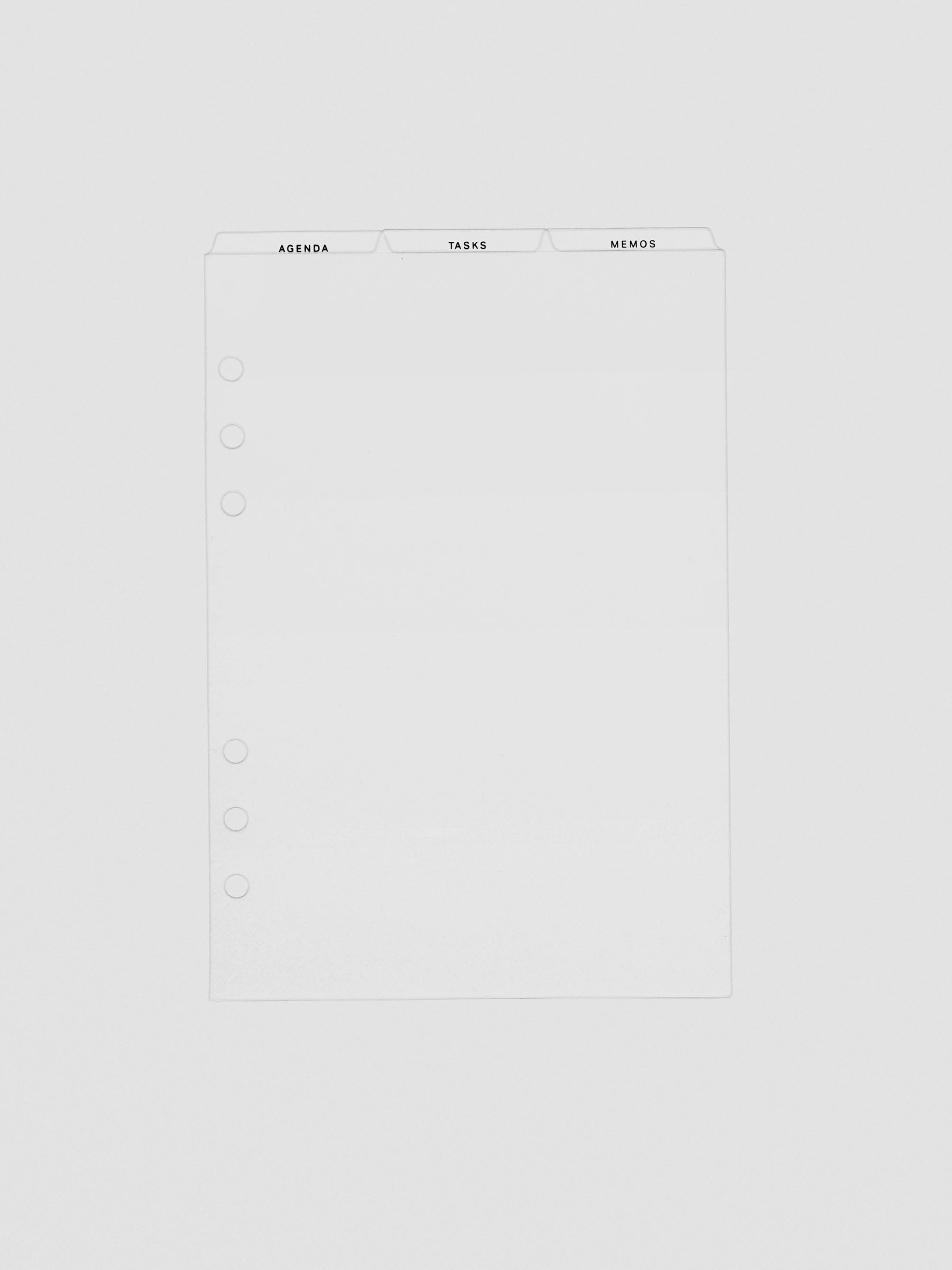 Ultra-thin clear planner dividers with top tabs labeled Agenda, Tasks, and Memos. Features six-hole punches on the side for binder compatibility.