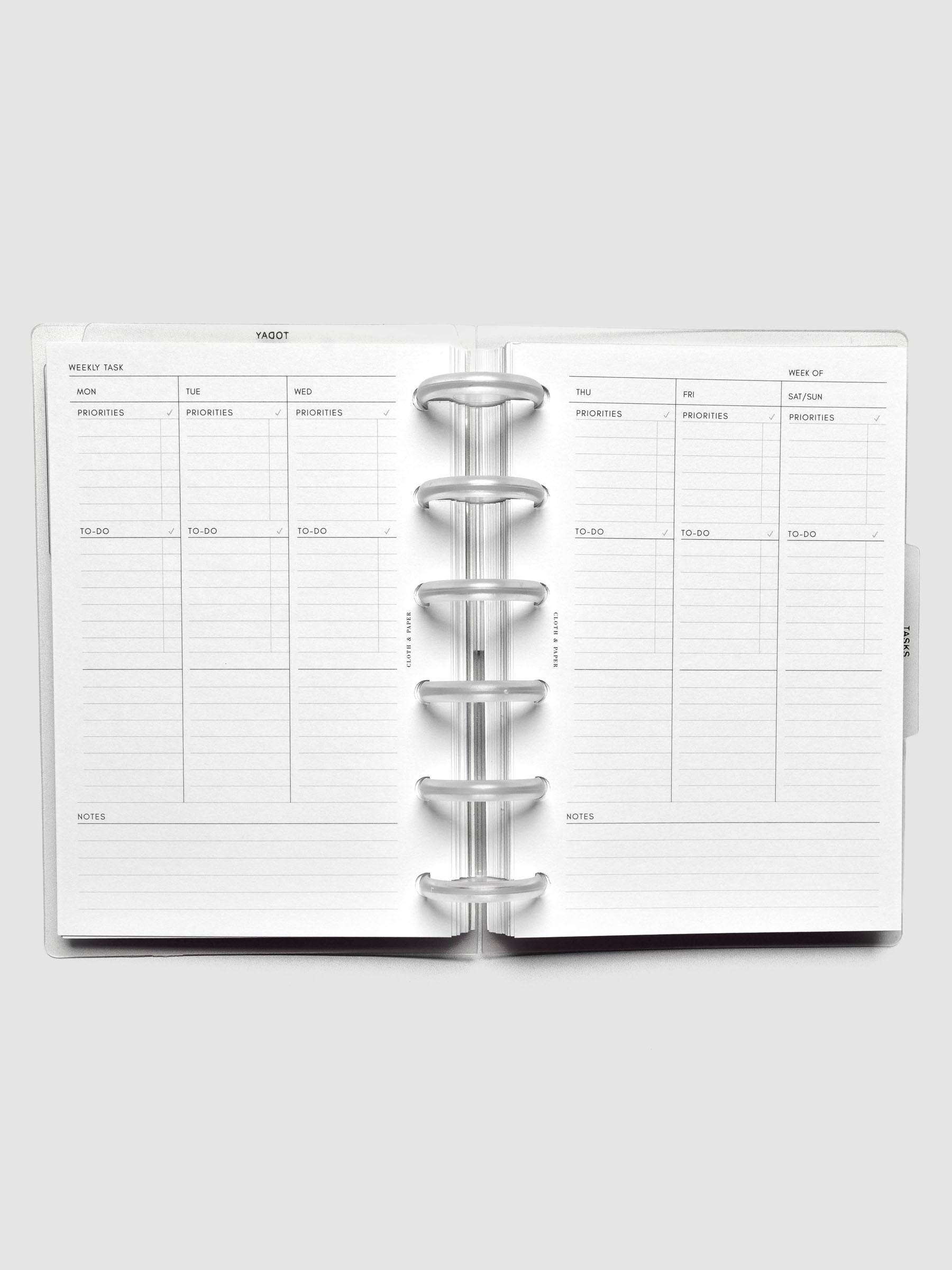 Open discbound planner displaying a weekly task layout with sections for additional notes.