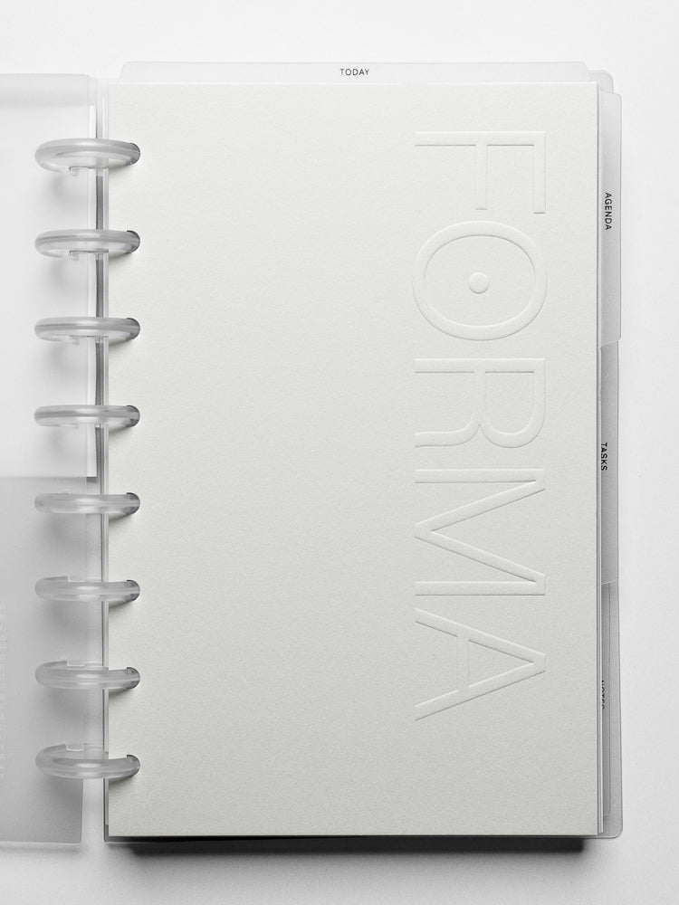 Close up view of the Forma Modular Planner System side tab dividers labeled agenda, tasks, and notes.