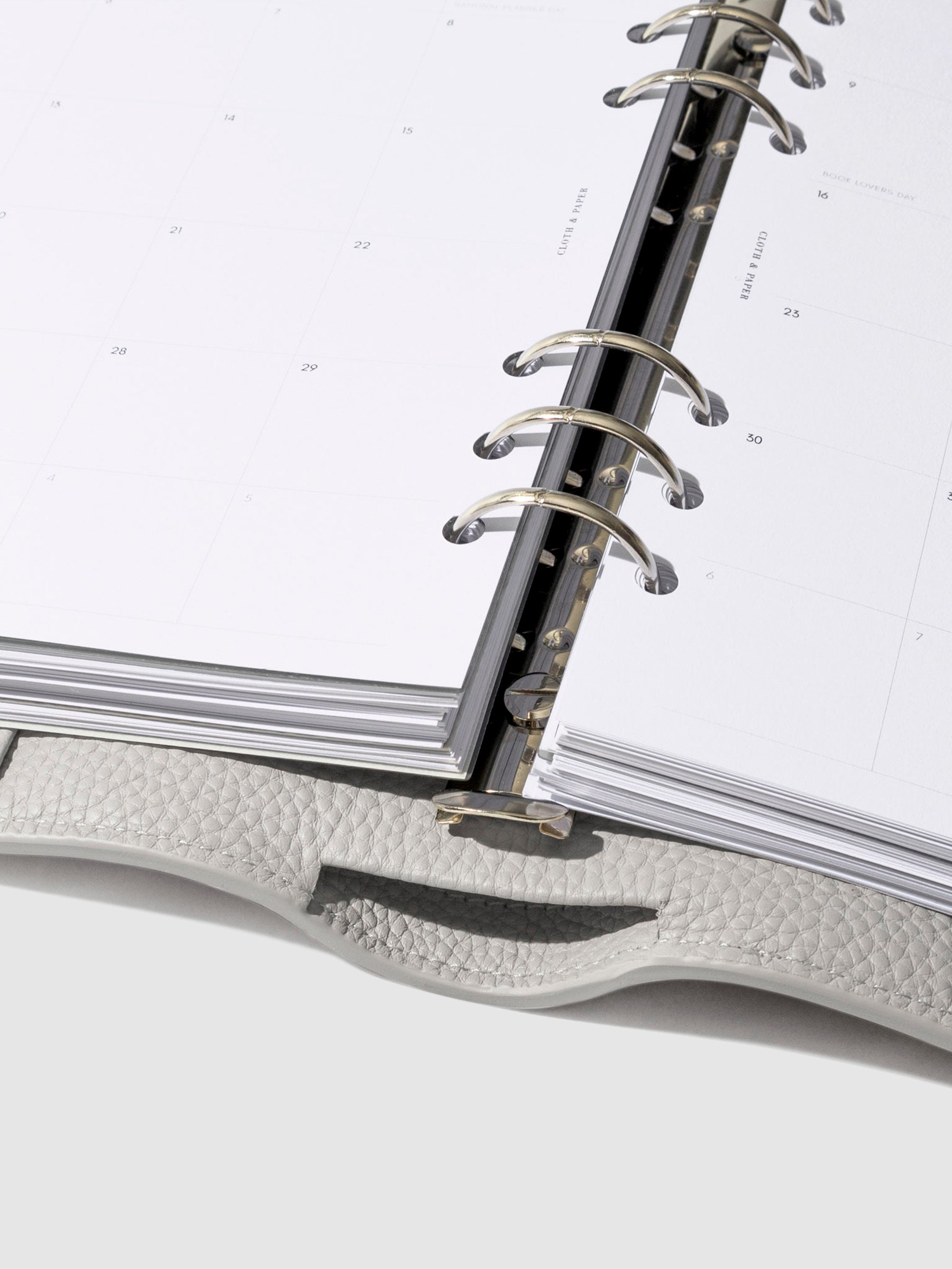 Close-up of the ash leather agenda ring mechanism.