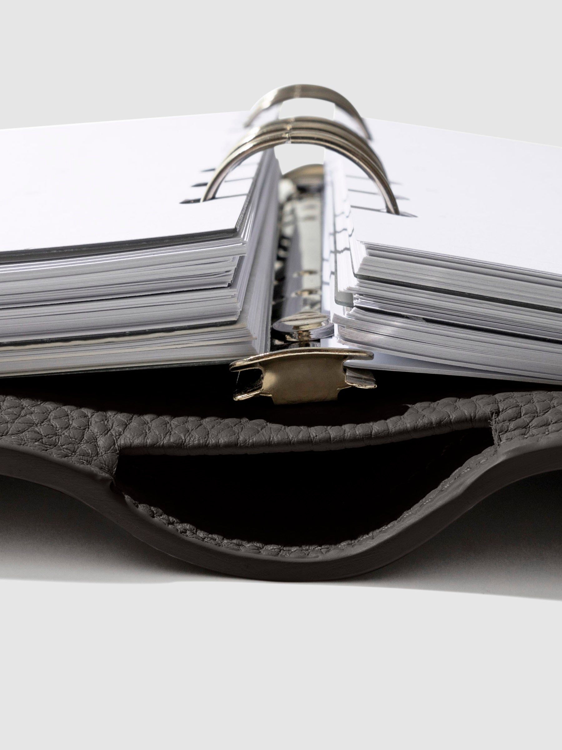 Close-up of the cafenoir leather agenda ring mechanism.