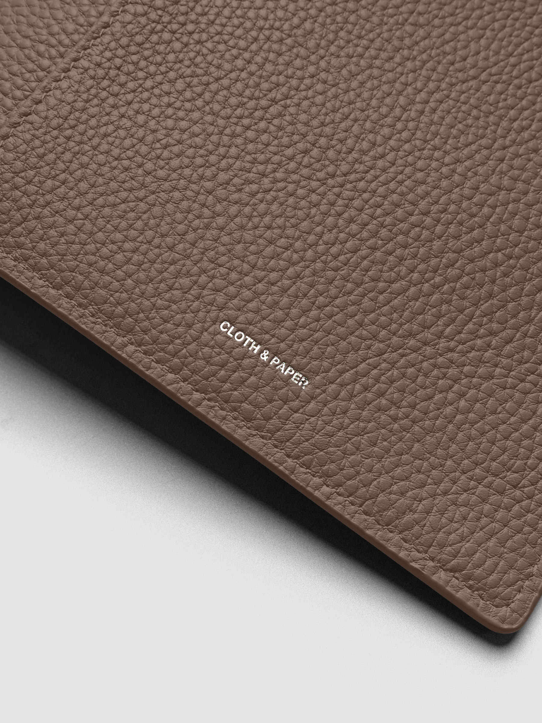 Close up of the Leather Agenda with silver Cloth & Paper logo embossing.