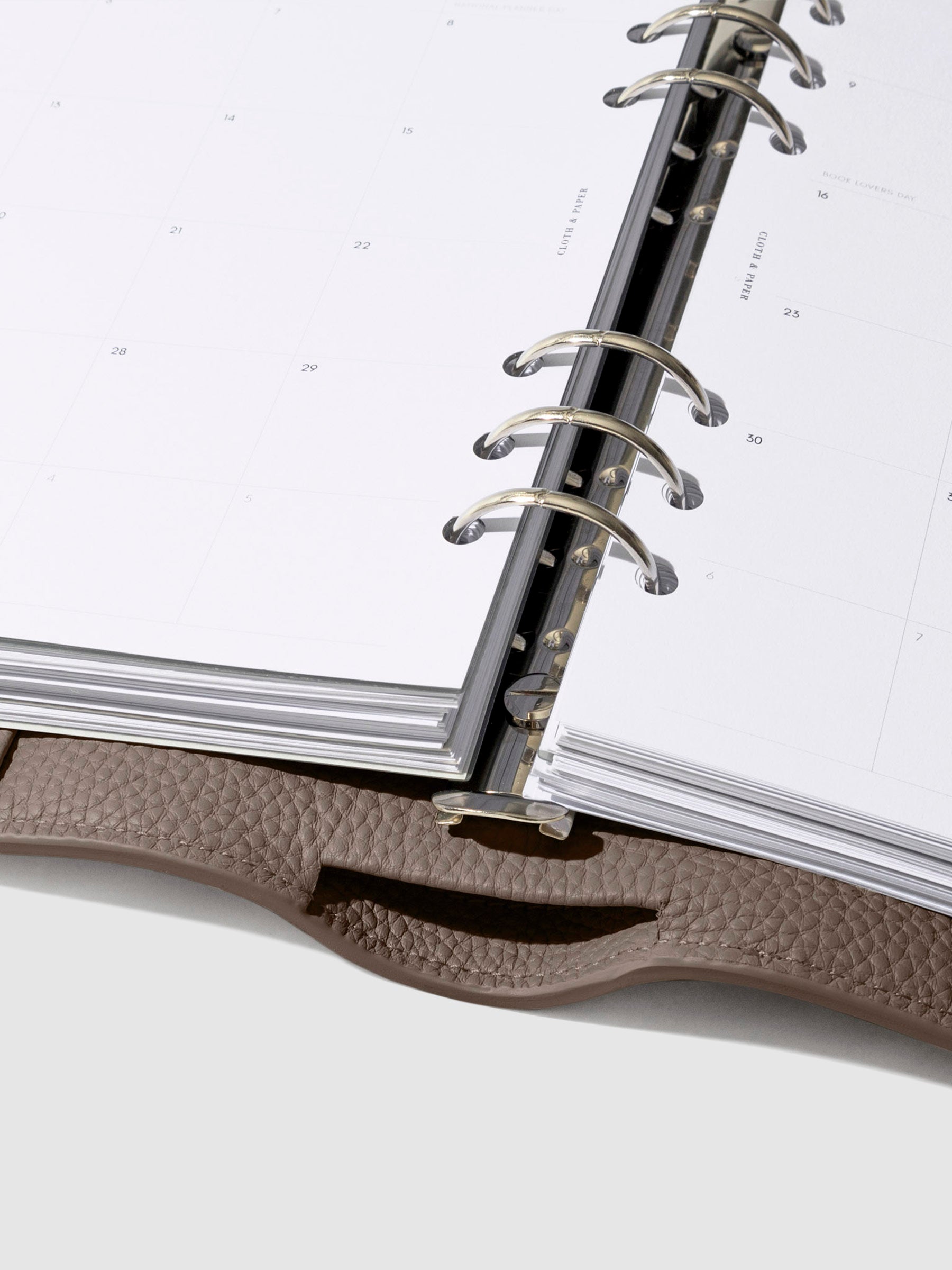 Close-up of the brown leather agenda ring mechanism.