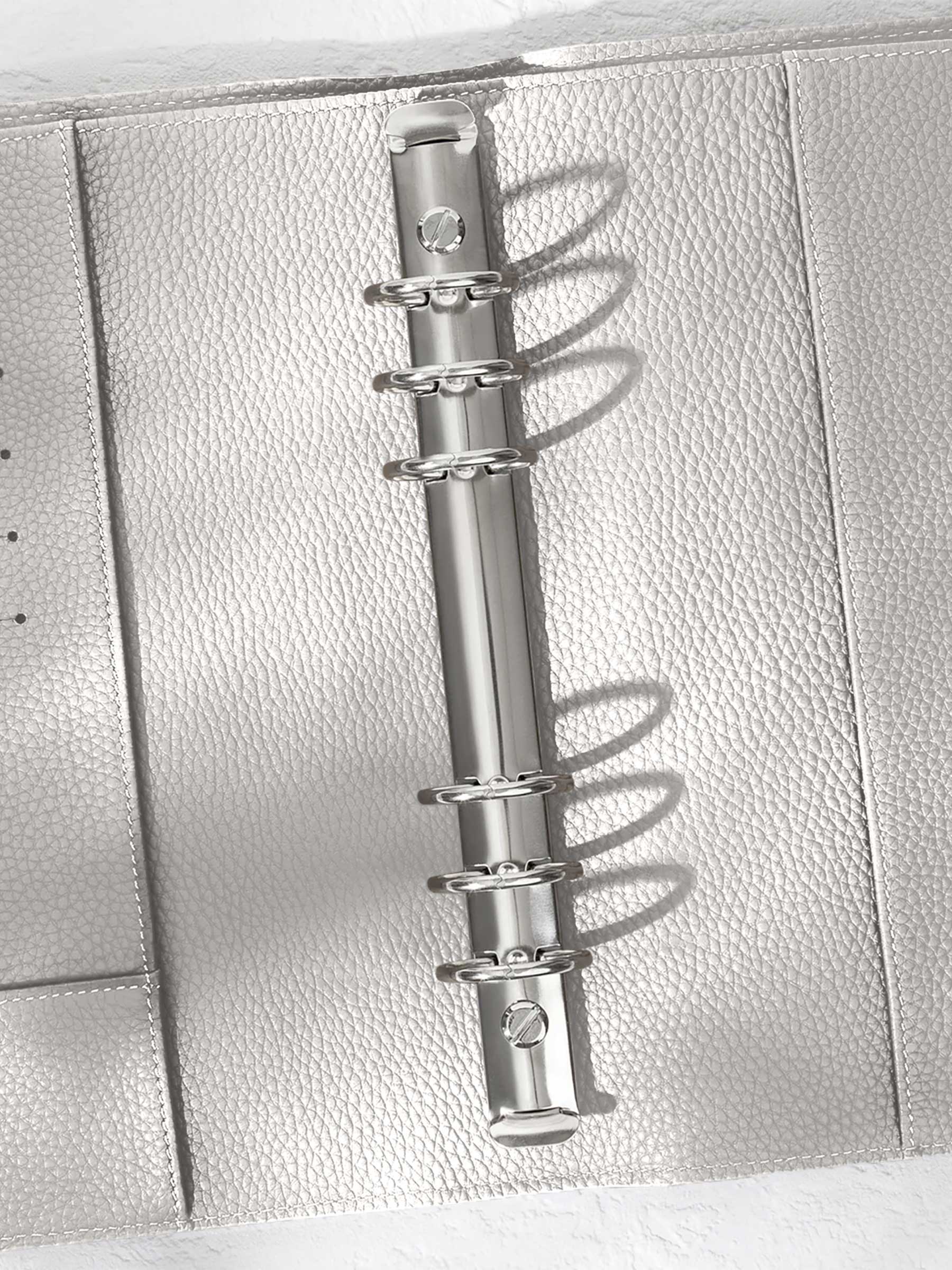 Closeup of silver hardware in an Ash leather agenda.