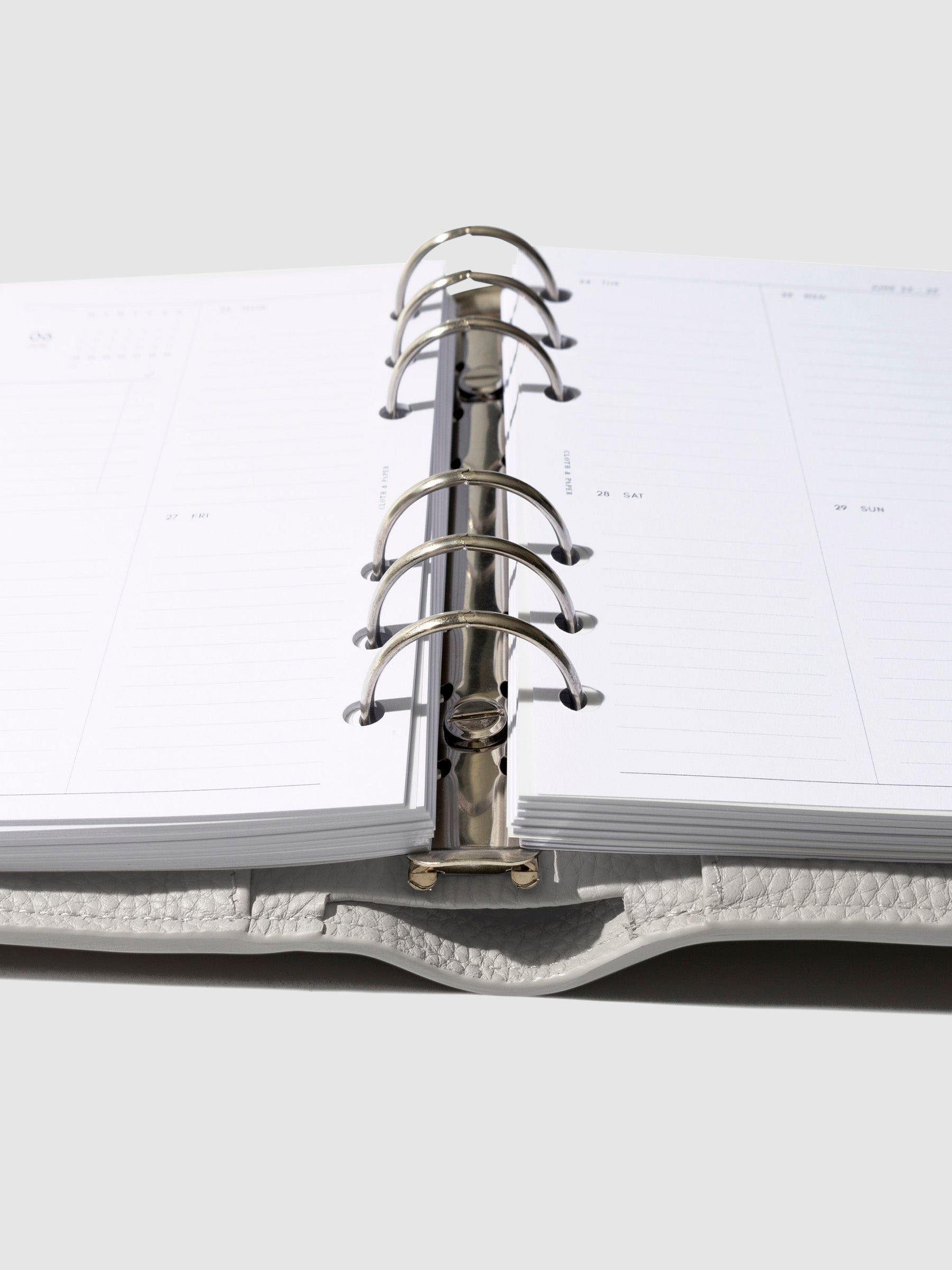 Close-up of the ash leather agenda ring mechanism.