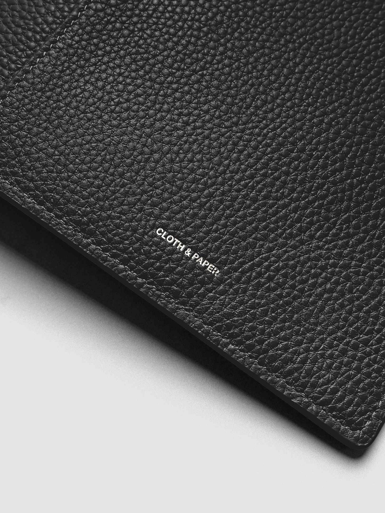 Close up of the Leather Agenda with silver Cloth & Paper logo embossing.