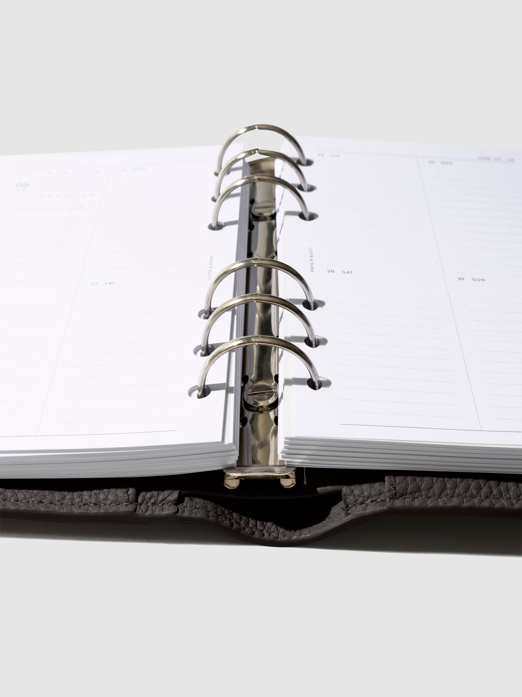 Close-up of the cafenoir leather agenda ring mechanism.