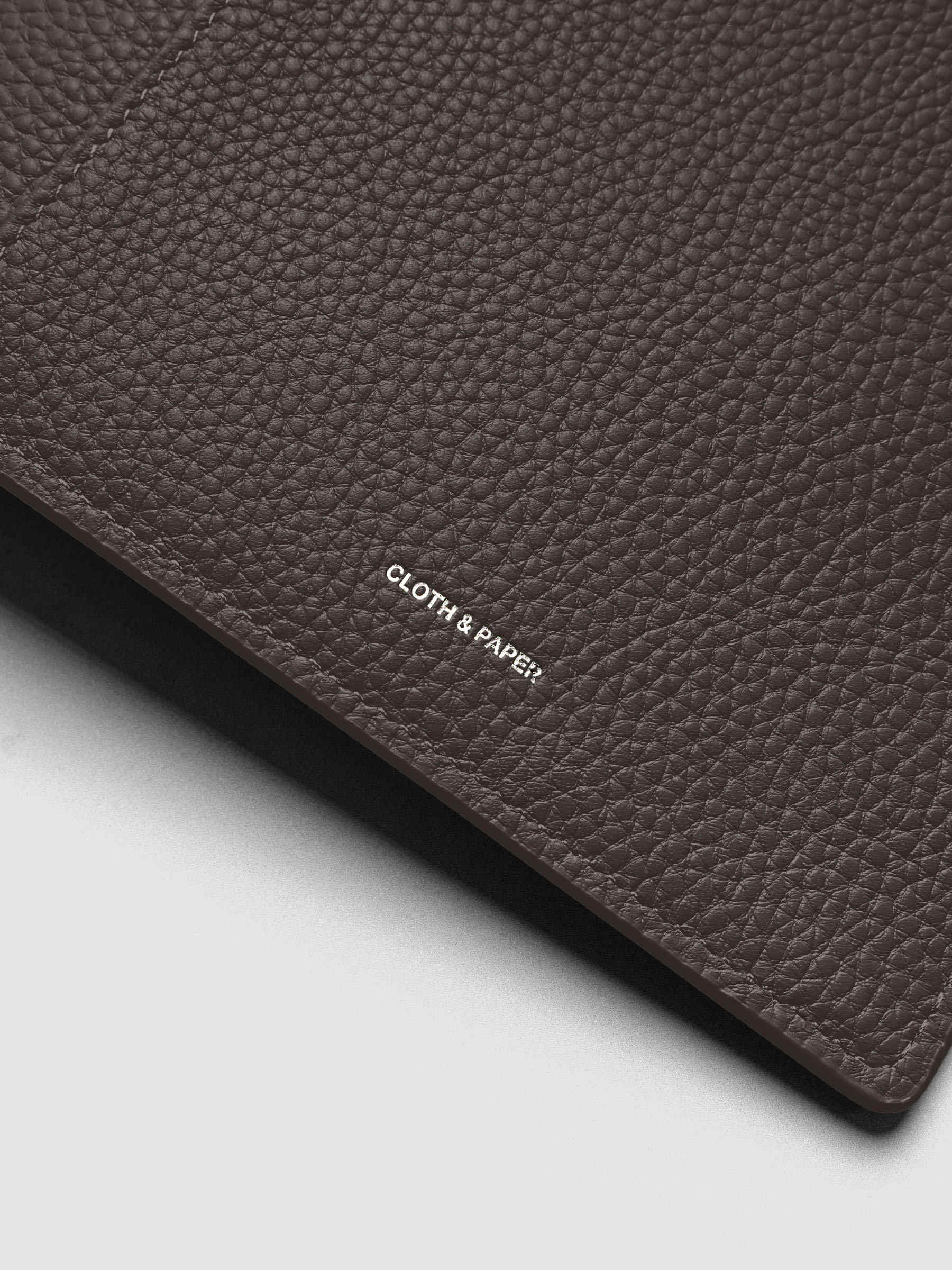 Close up of the Leather Agenda with silver Cloth & Paper logo embossing.