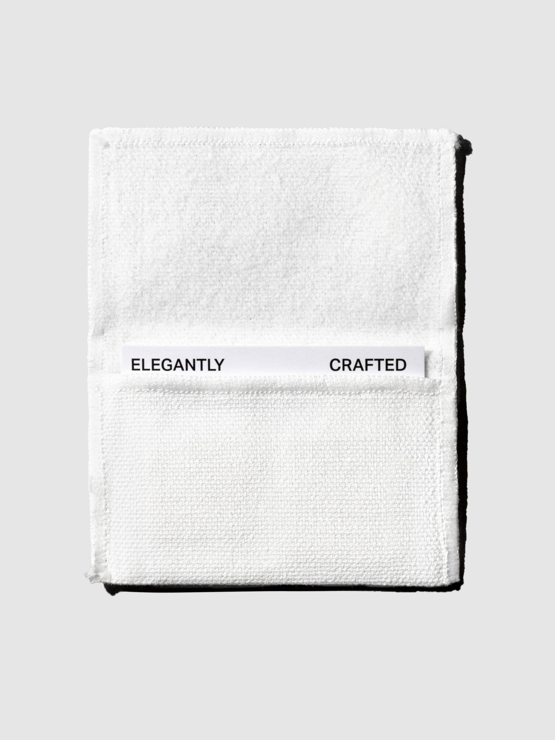 Pin packaging displayed on a neutral background. Packaging reads "elegantly crafted."