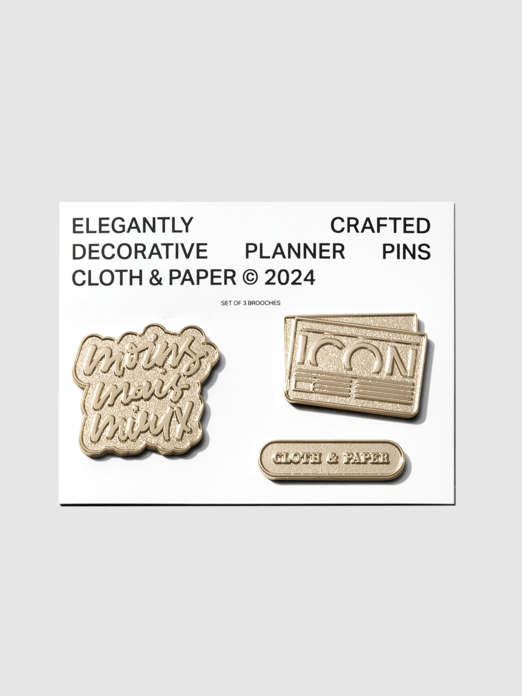 Planner Brooch Set, Cloth and Paper. Set of 3 pins on their backing on a neutral background.