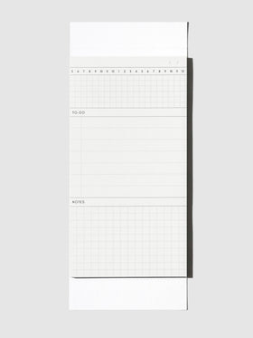 Graph Pad Sticky Note, Cloth and Paper. Sticky note on its backing displayed on a neutral background.