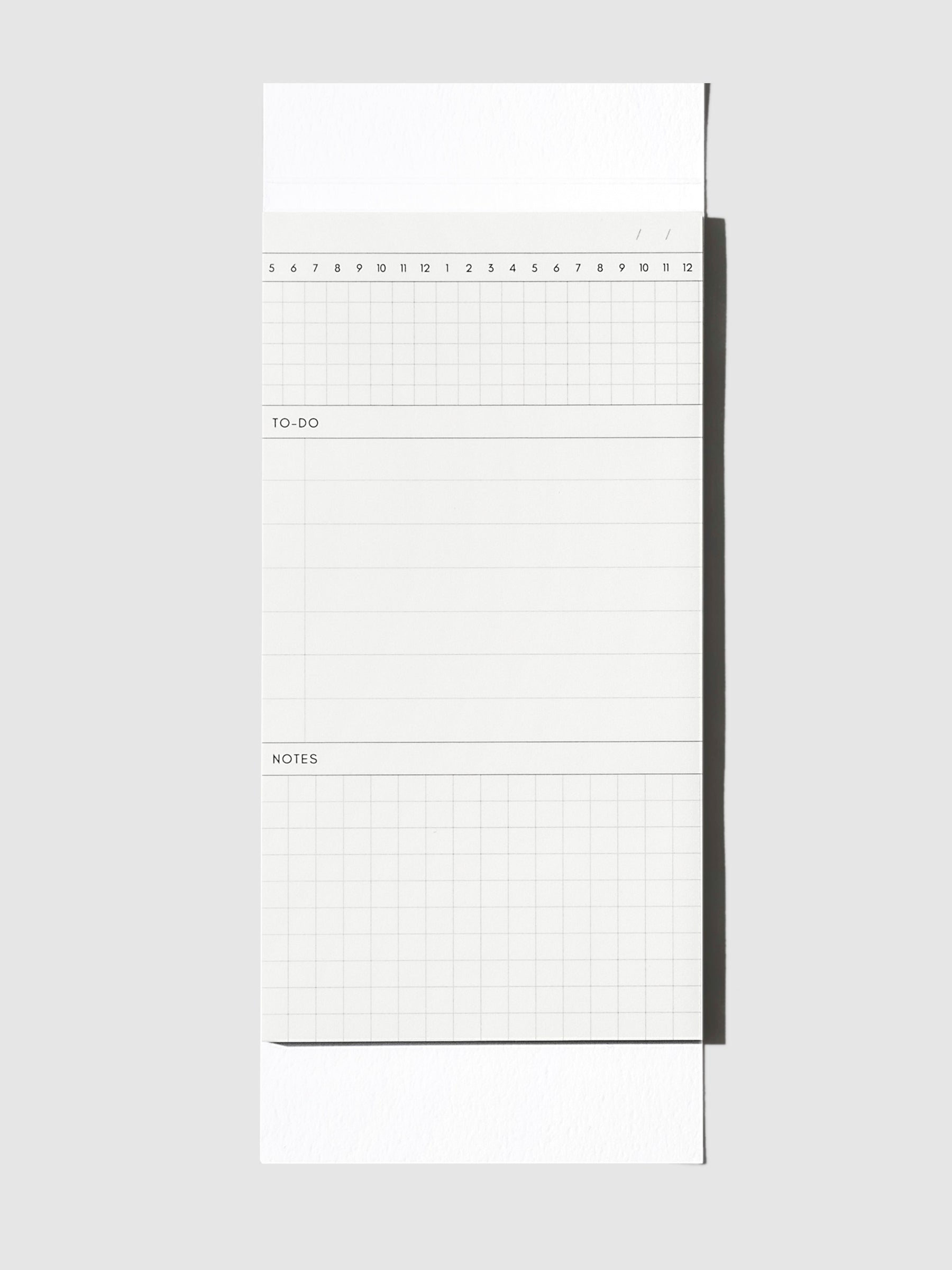 Graph Pad Sticky Note, Cloth and Paper. Sticky note on its backing displayed on a neutral background.