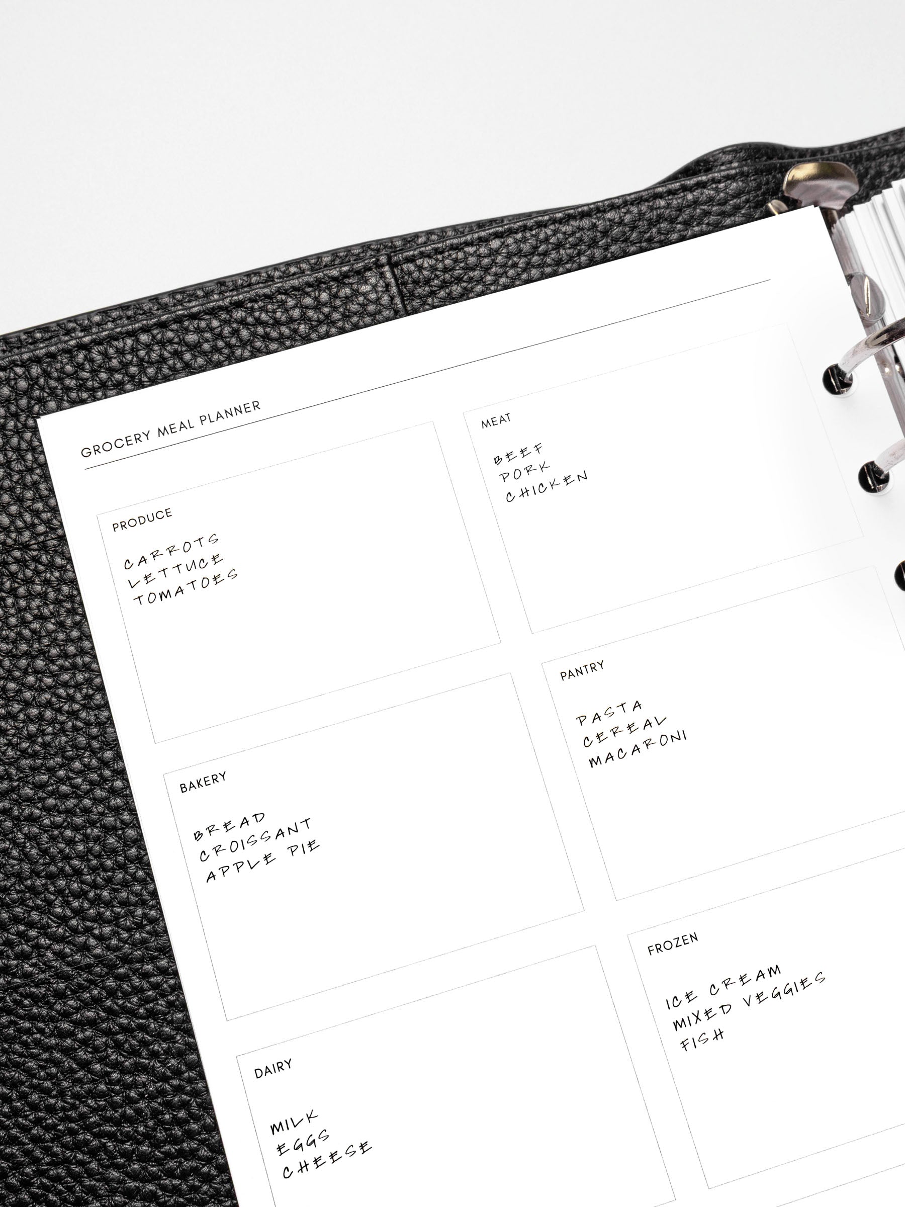 Closeup of a Grocery Meal Planner Insert inside a planner.