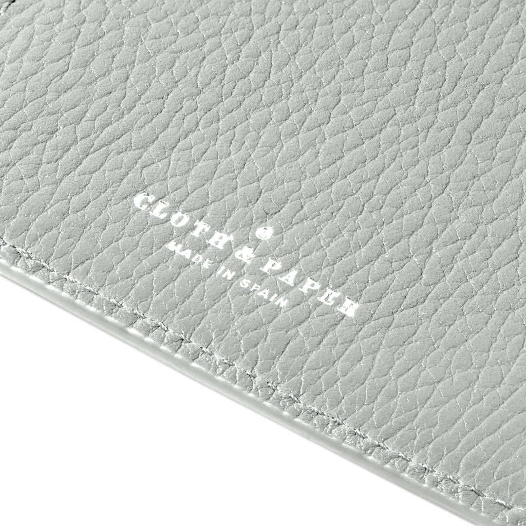 Closeup of Veleta folio's foil-stamped Cloth and Paper Made in Spain logo.