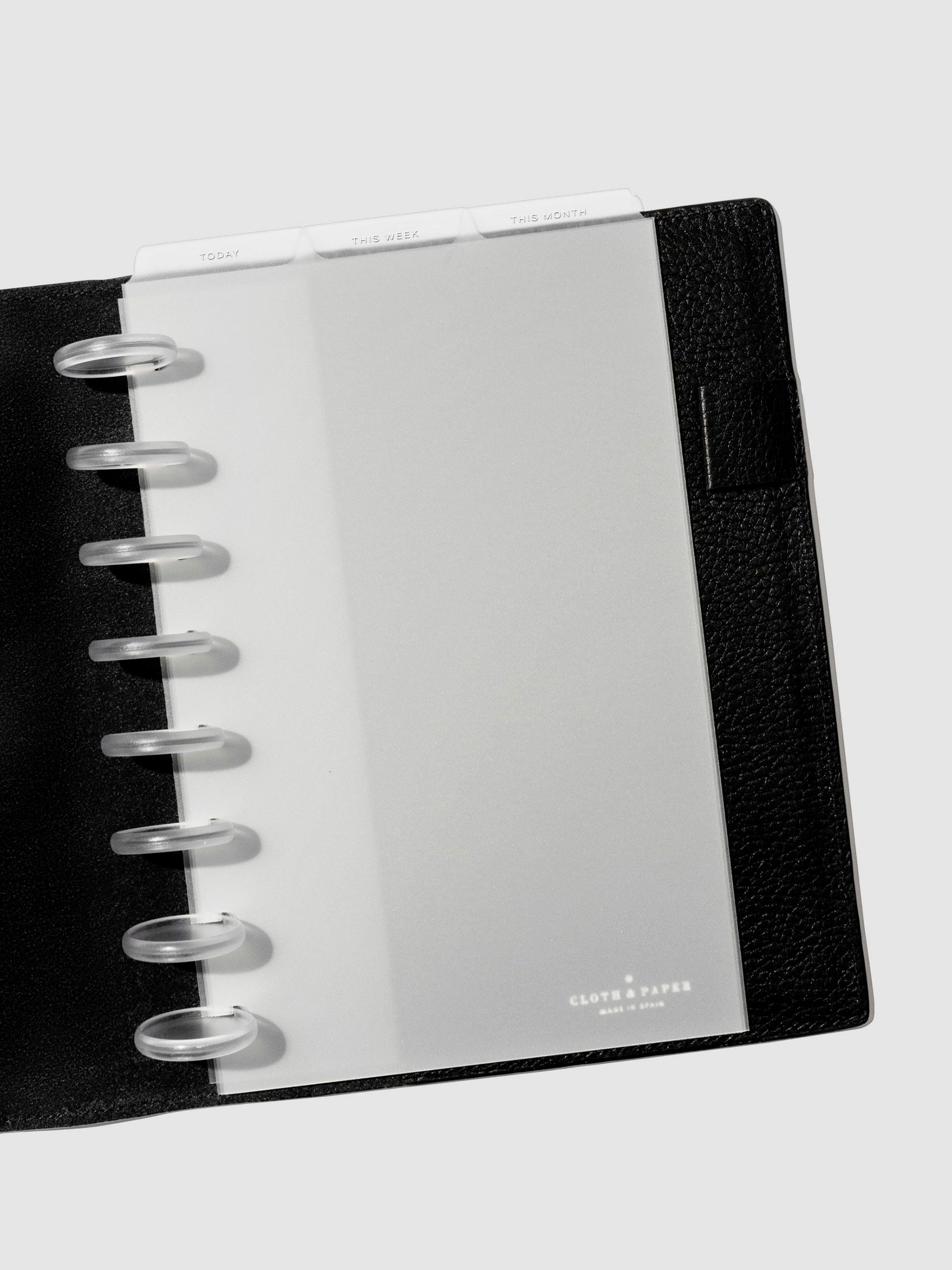 Dividers shown in use inside a black leather folio. 
