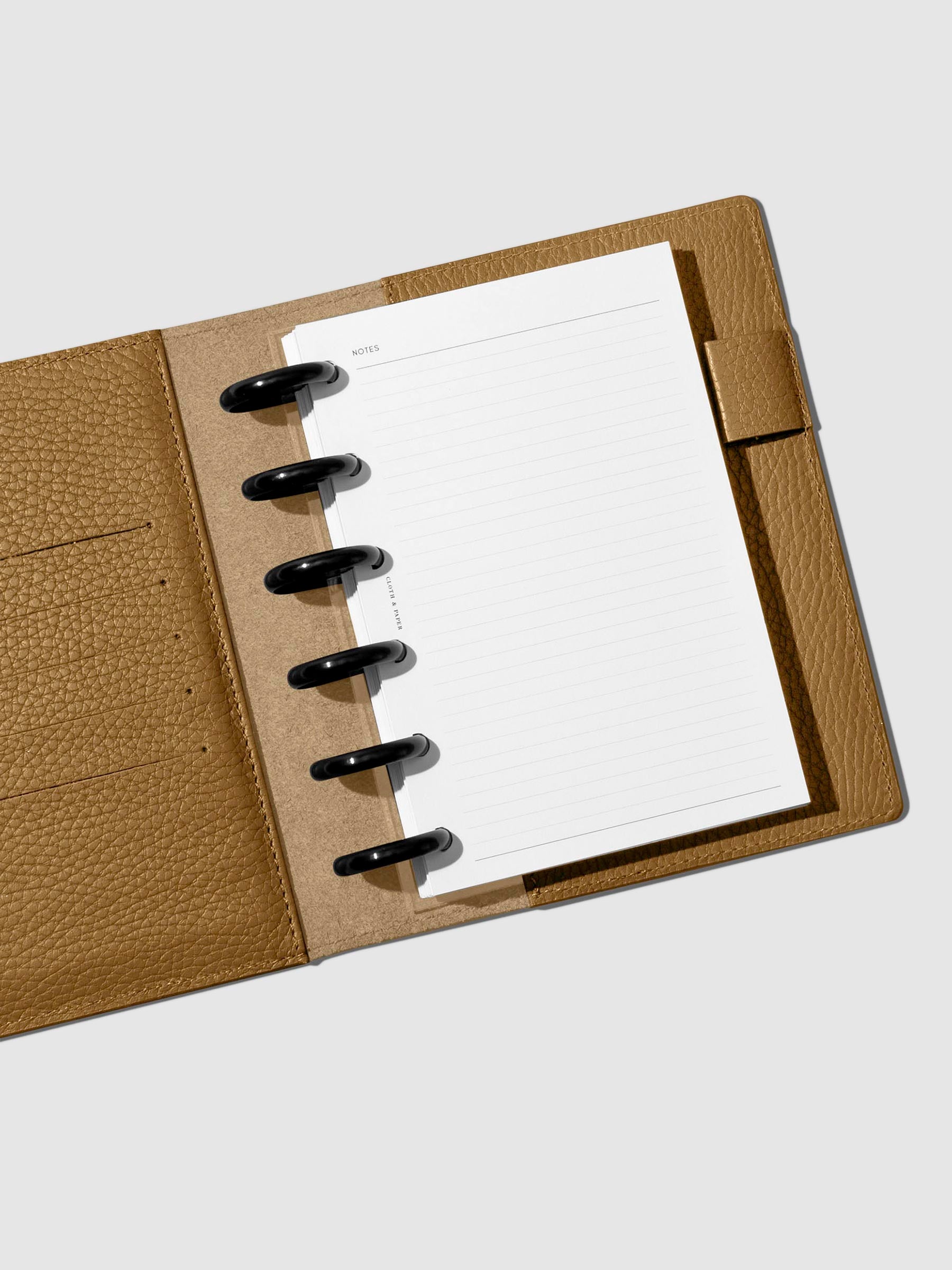 Folio displayed opened on a neutral background.