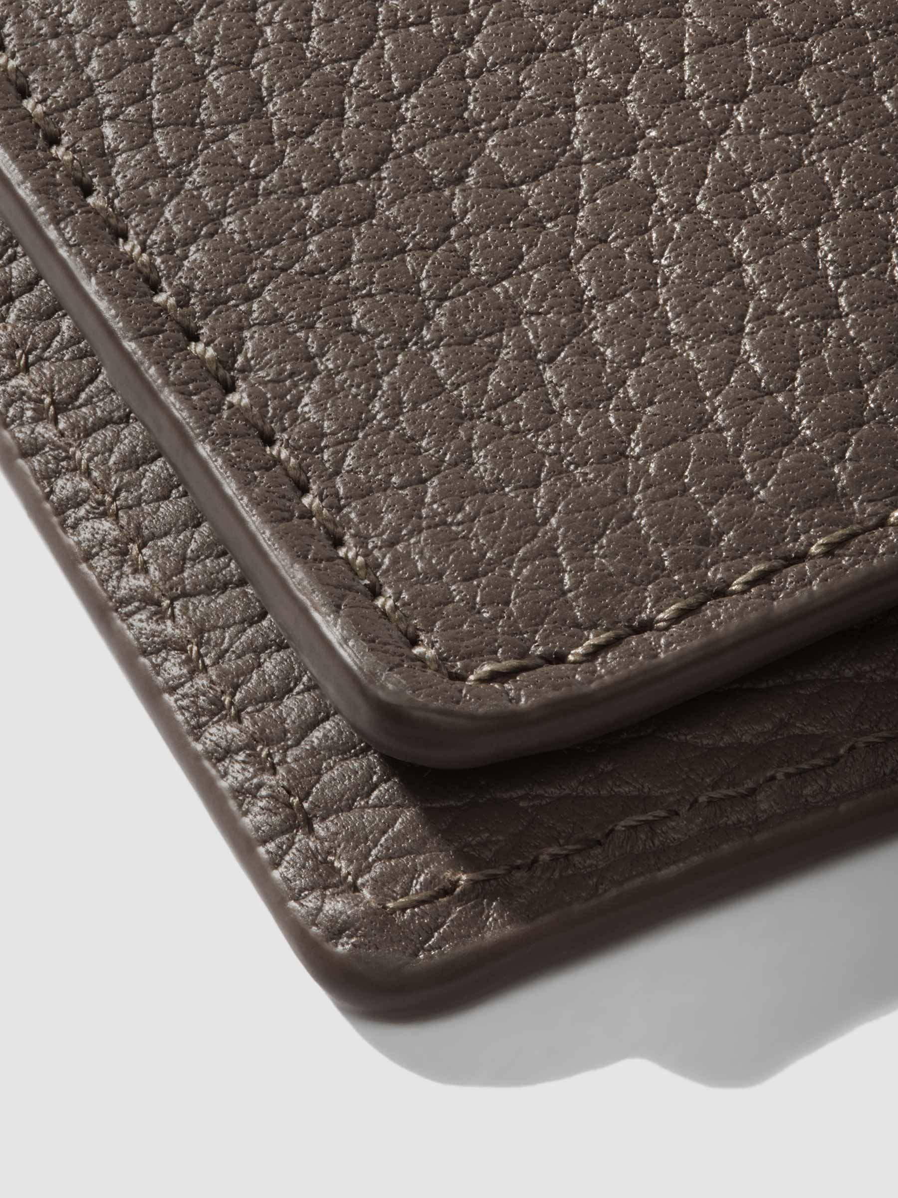 Closeup of Leon folio showing the stitching and glazing.