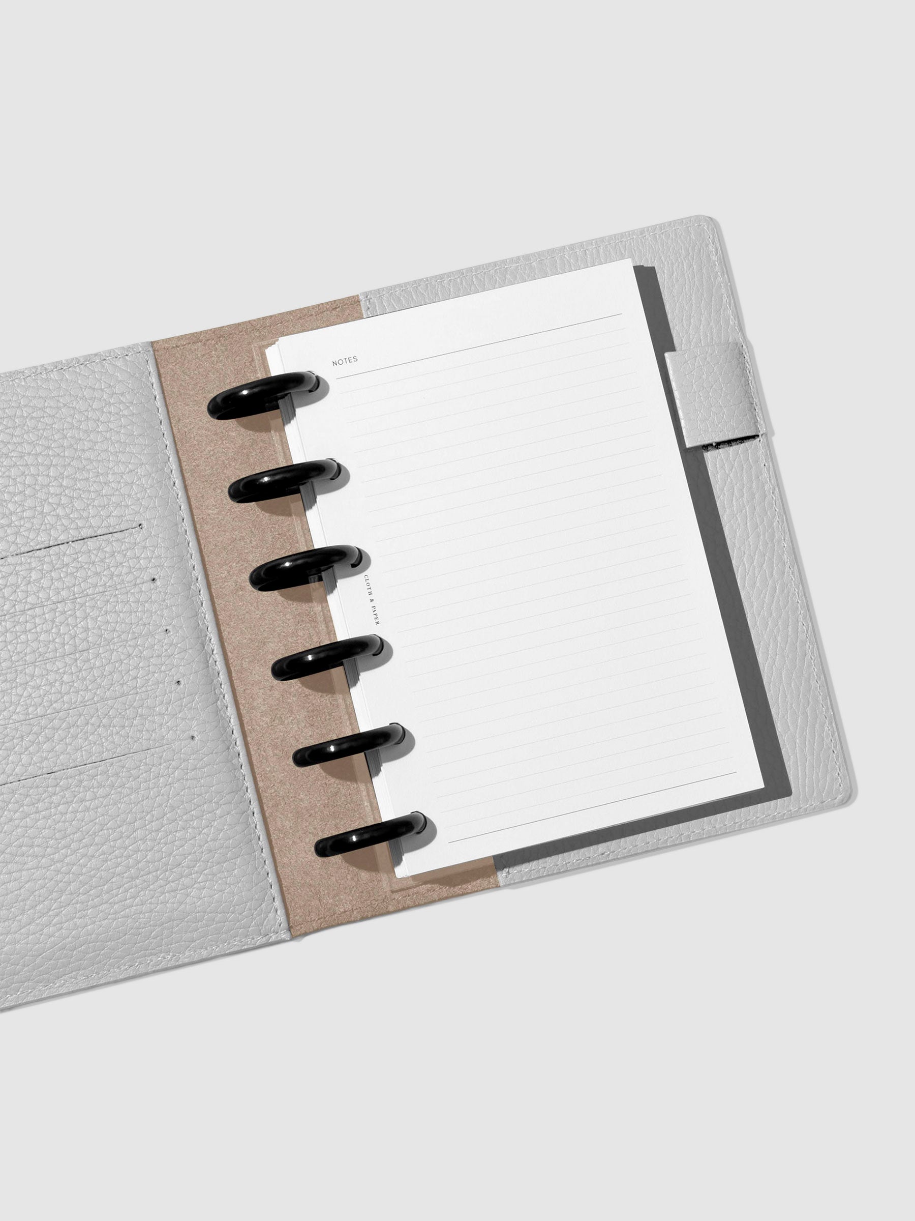 Folio displayed opened on a neutral background,