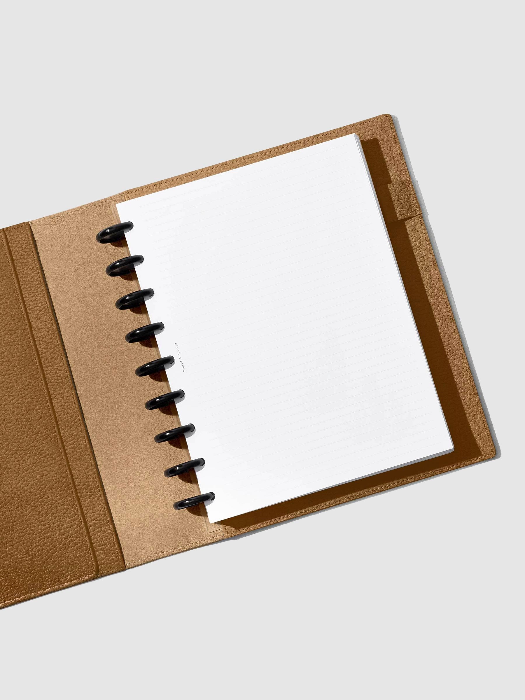 Folio displayed opened on a neutral background.