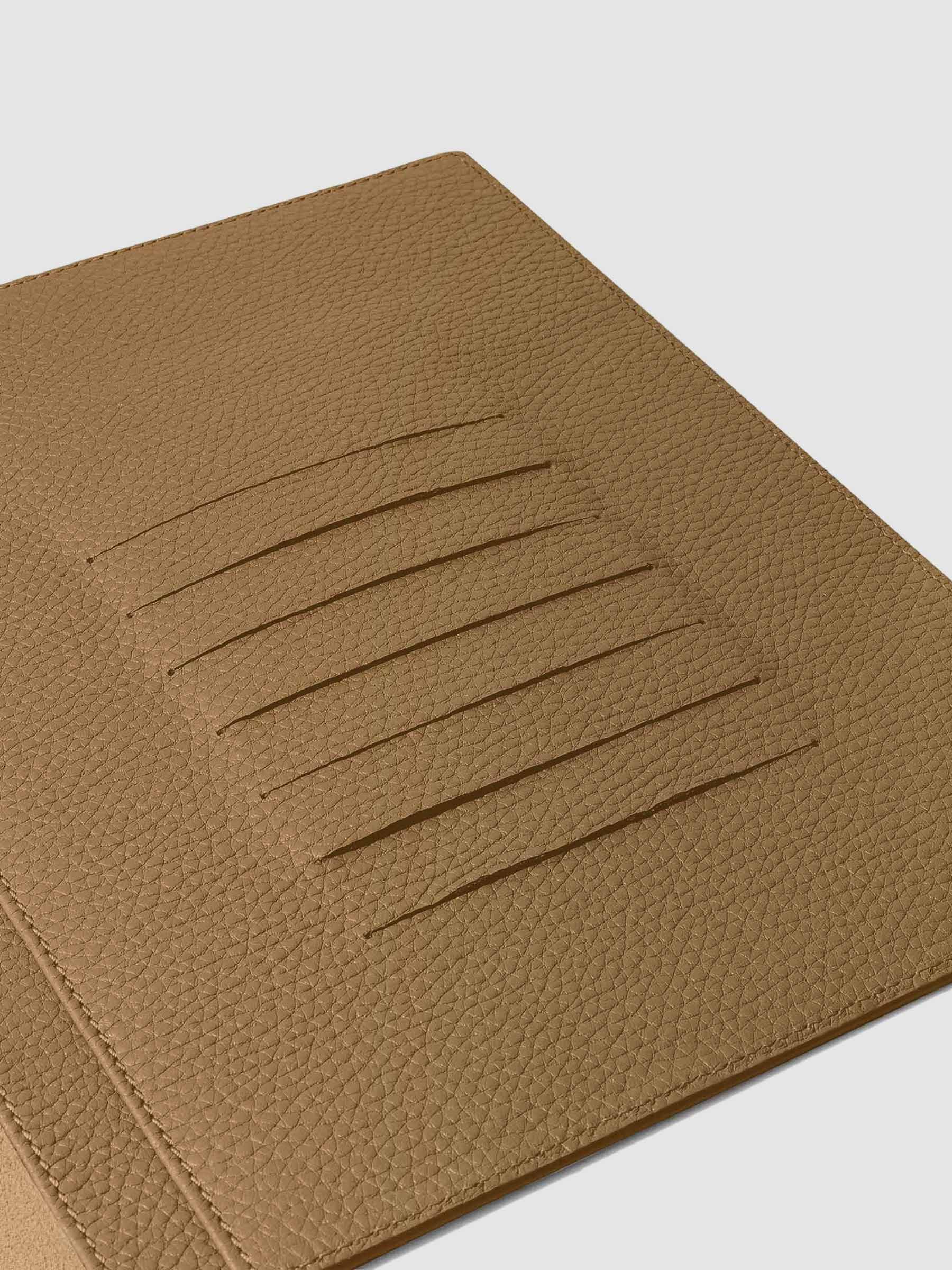 Closeup of credit card slots inside leather folio.