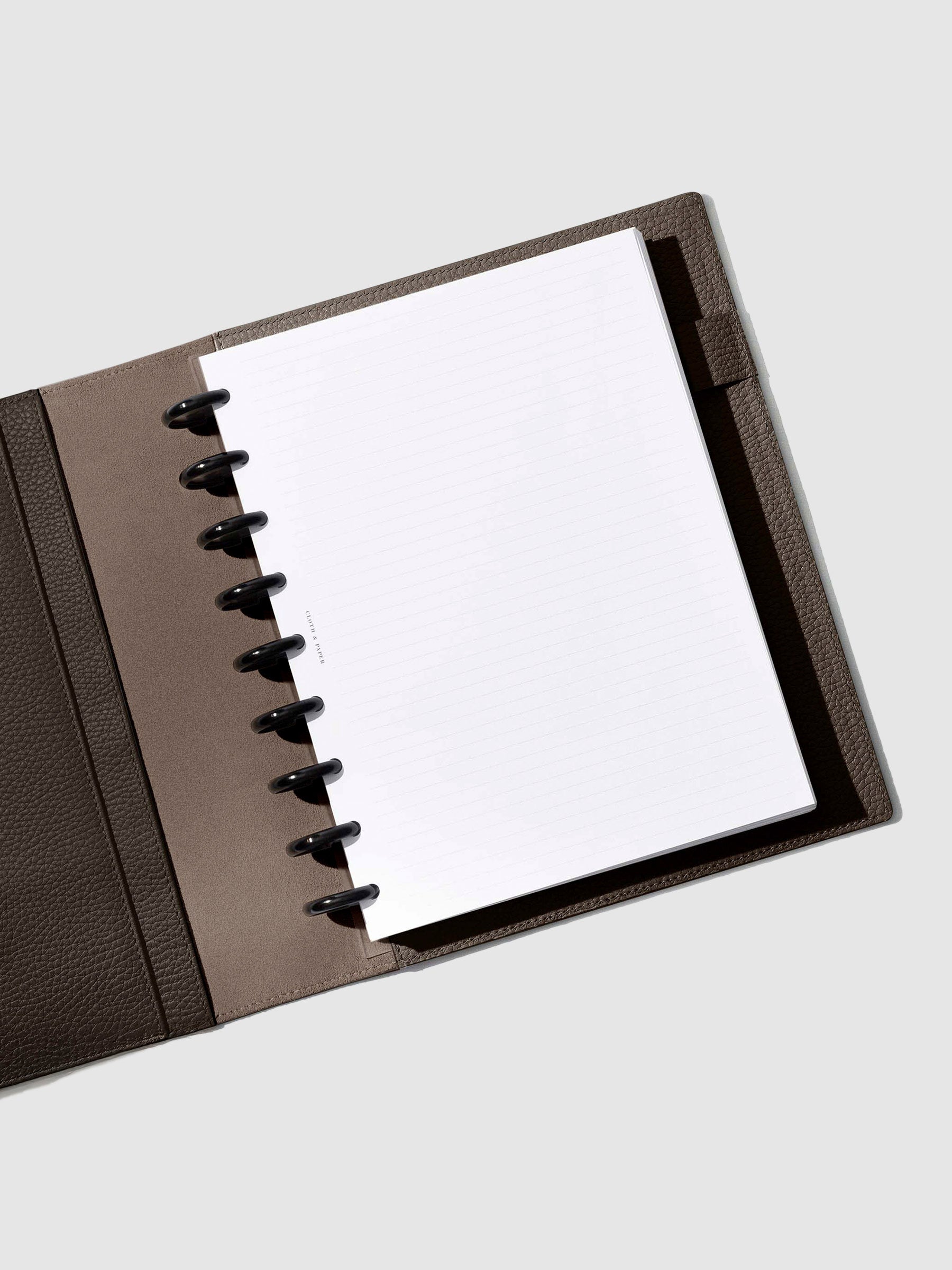 Folio displayed opened on a neutral background.