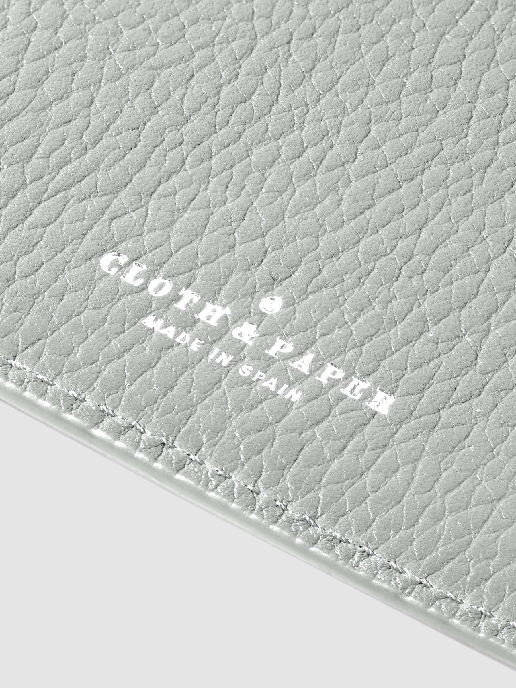 Closeup of silver foil stamp.