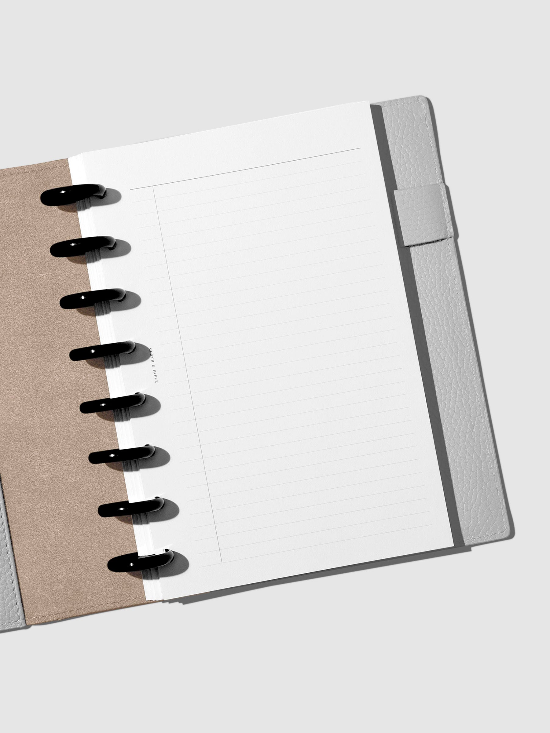 Folio displayed opened on a neutral background.