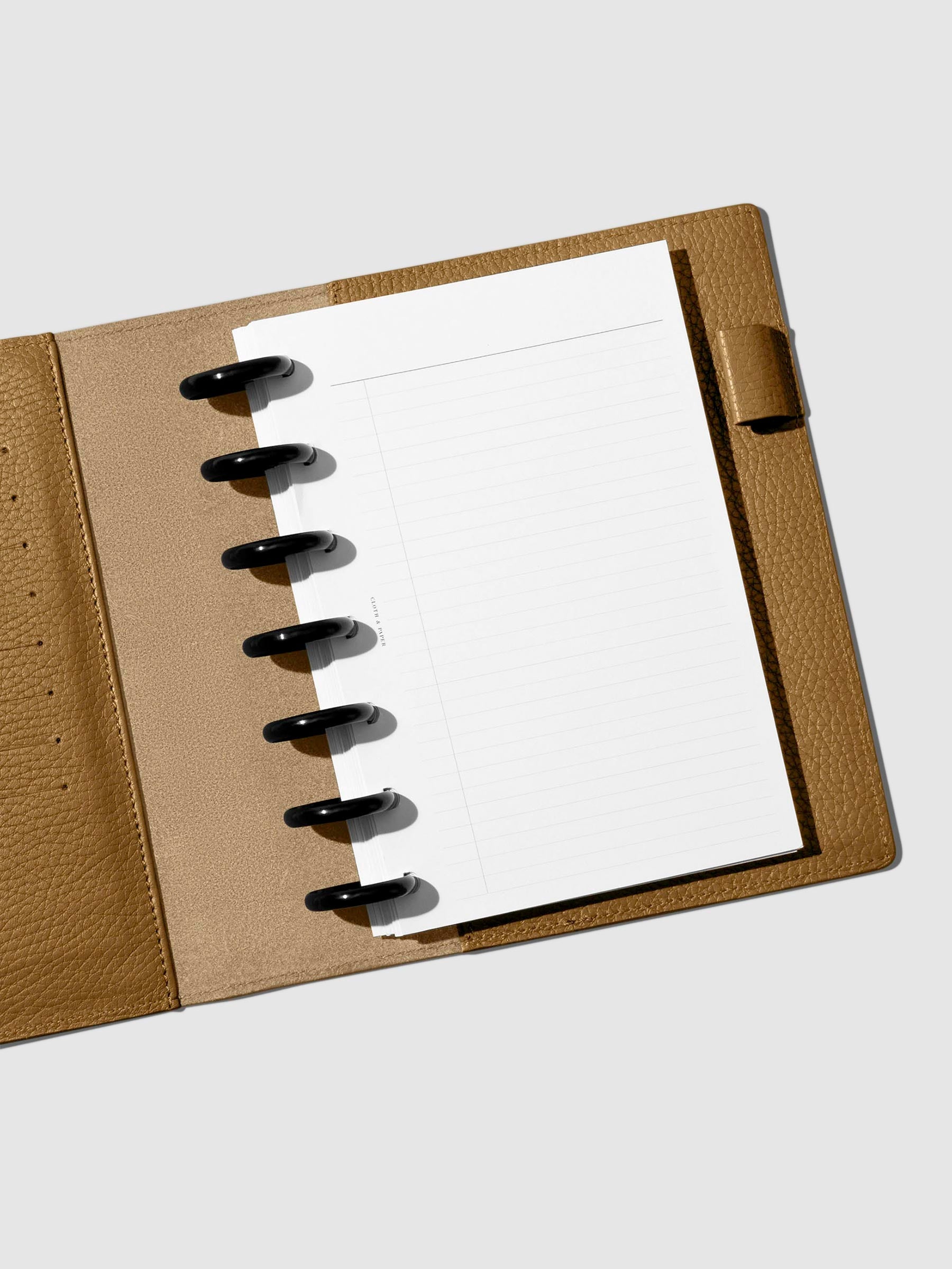 Folio displayed opened on a neutral background.