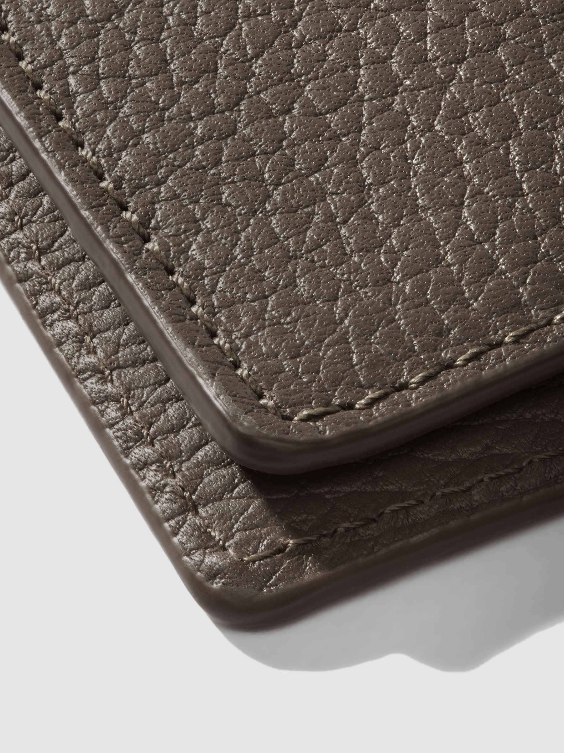 Closeup of Leon folio showing the stitching and glazing.