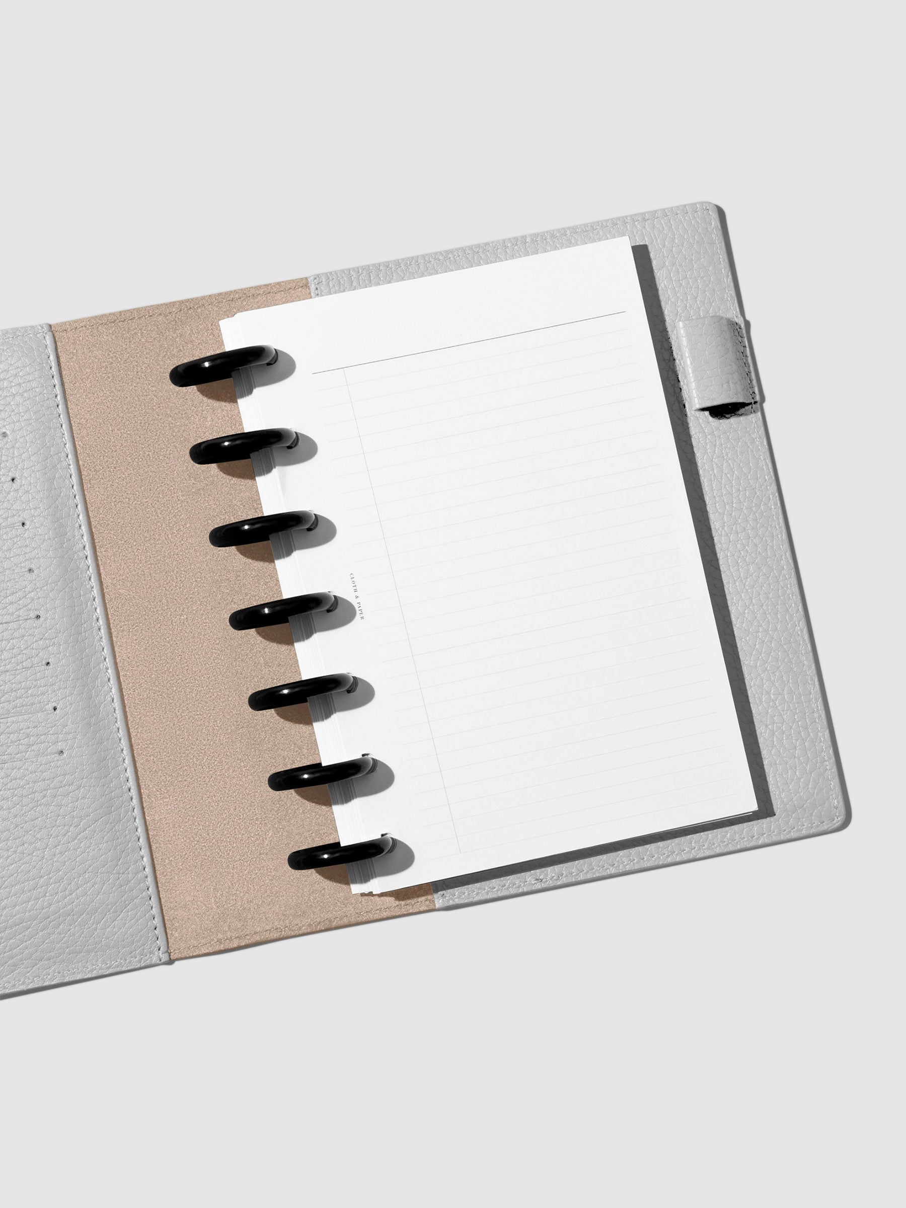 Folio displayed opened on a neutral background.