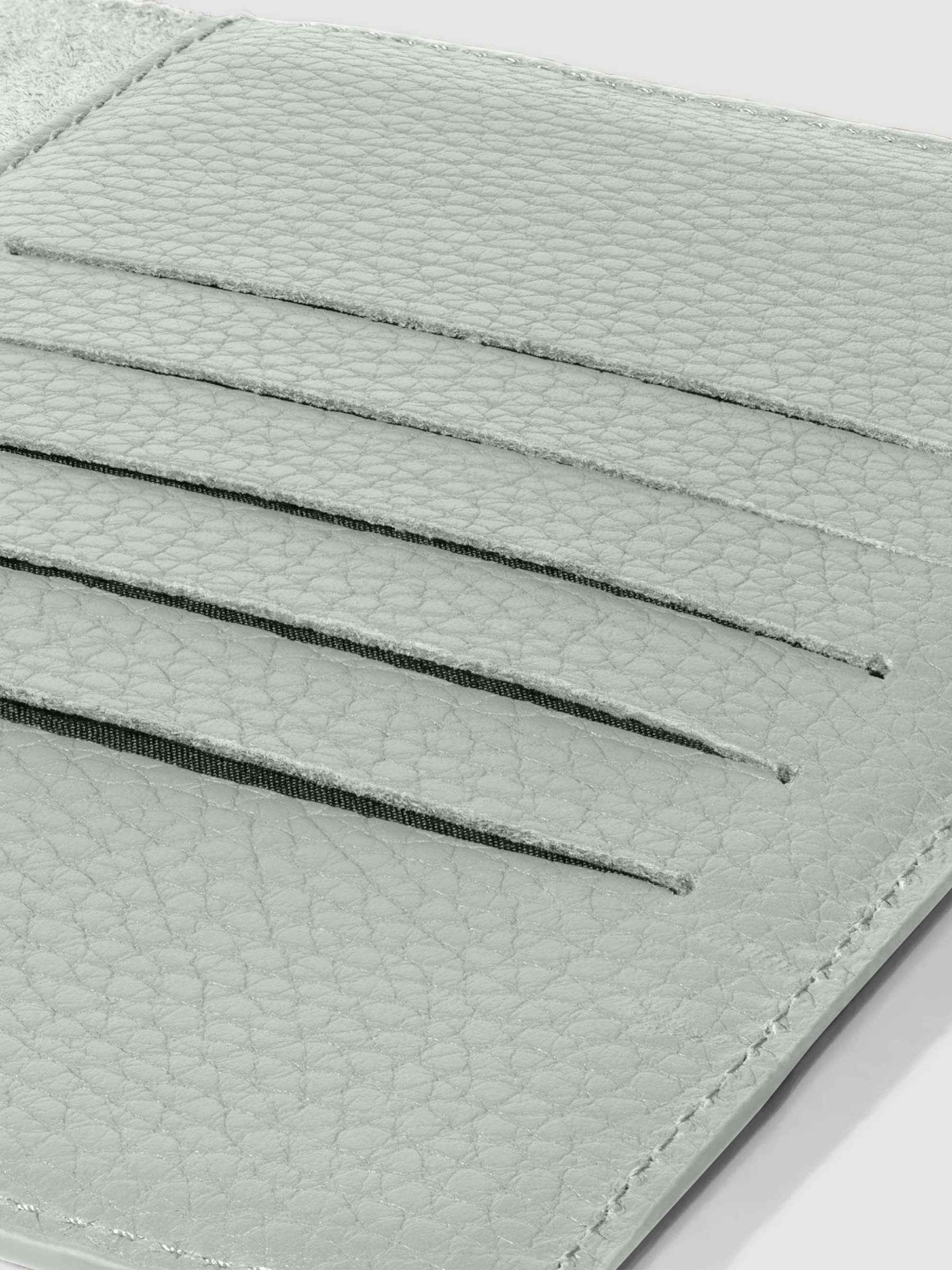 Closeup of Veleta folio showing the hand-cut credit card slots.