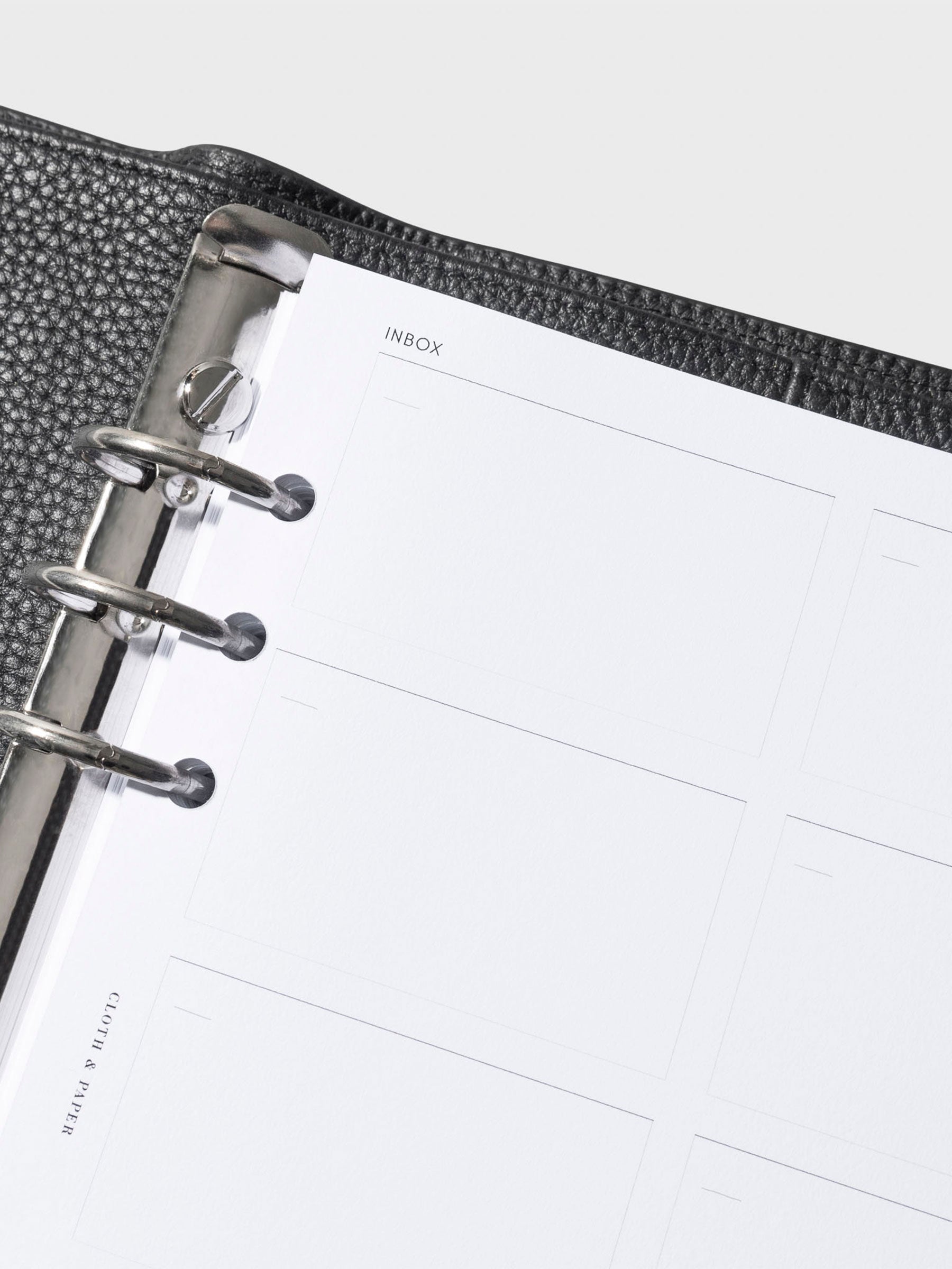 Closeup of insert inside a black leather agenda.